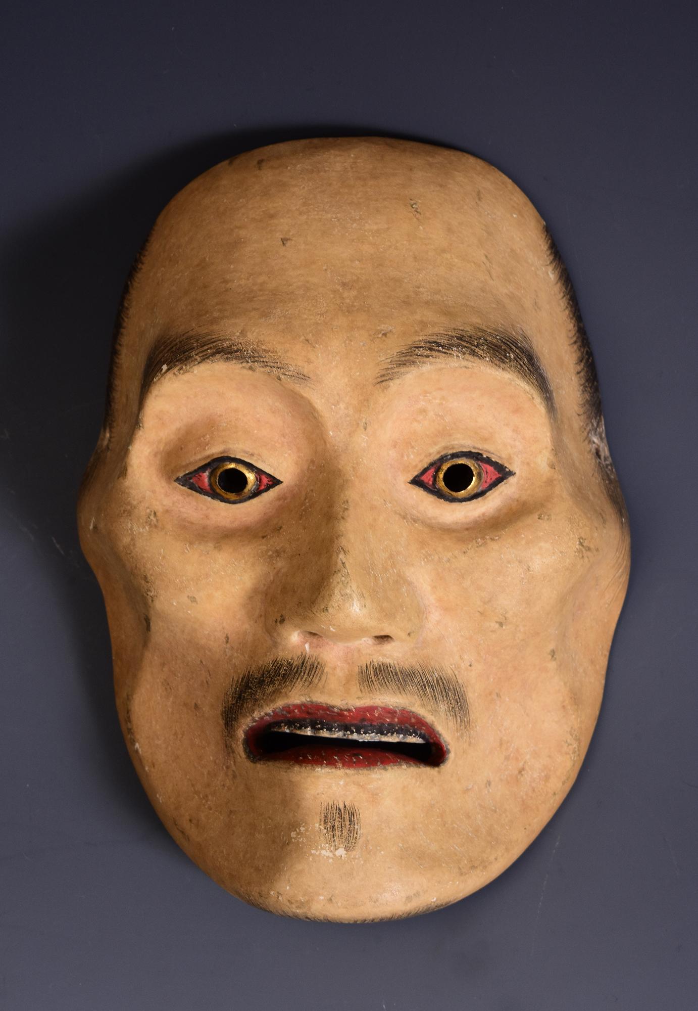 Antique Japanese wooden Noh mask.

Age: Japan, Meiji Period, 19th Century
Size: Length 20.3 C.M. / Width 14.7 C.M. / Thickness 9.3 C.M.
Condition: Nice condition overall (some expected degradation due to its age).

100% satisfaction and authenticity