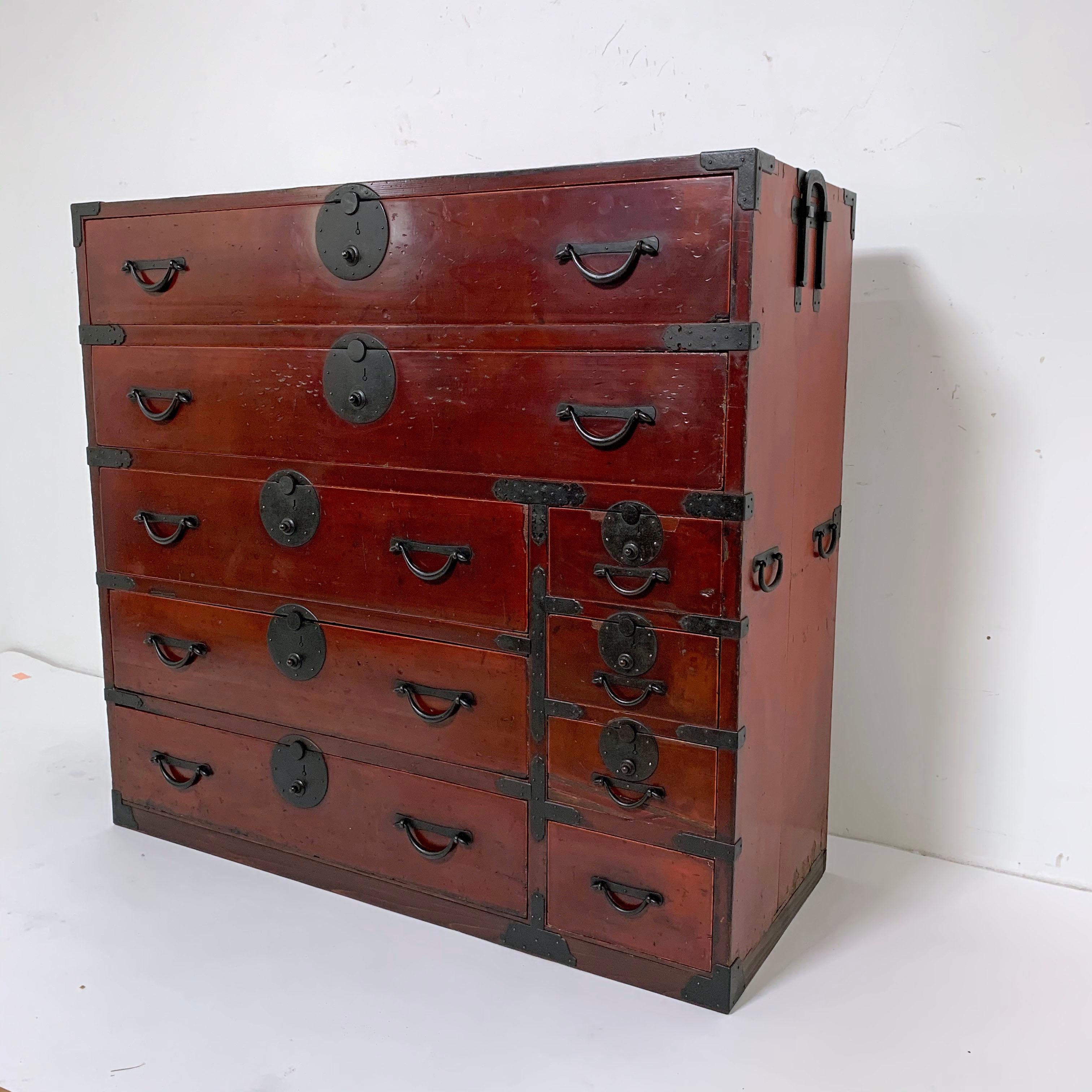 19th century Japanese tansu Meiji period chest, featuring a rich dark amber lacquered finish and original hand forged iron hardware.
Case measures: 45.25