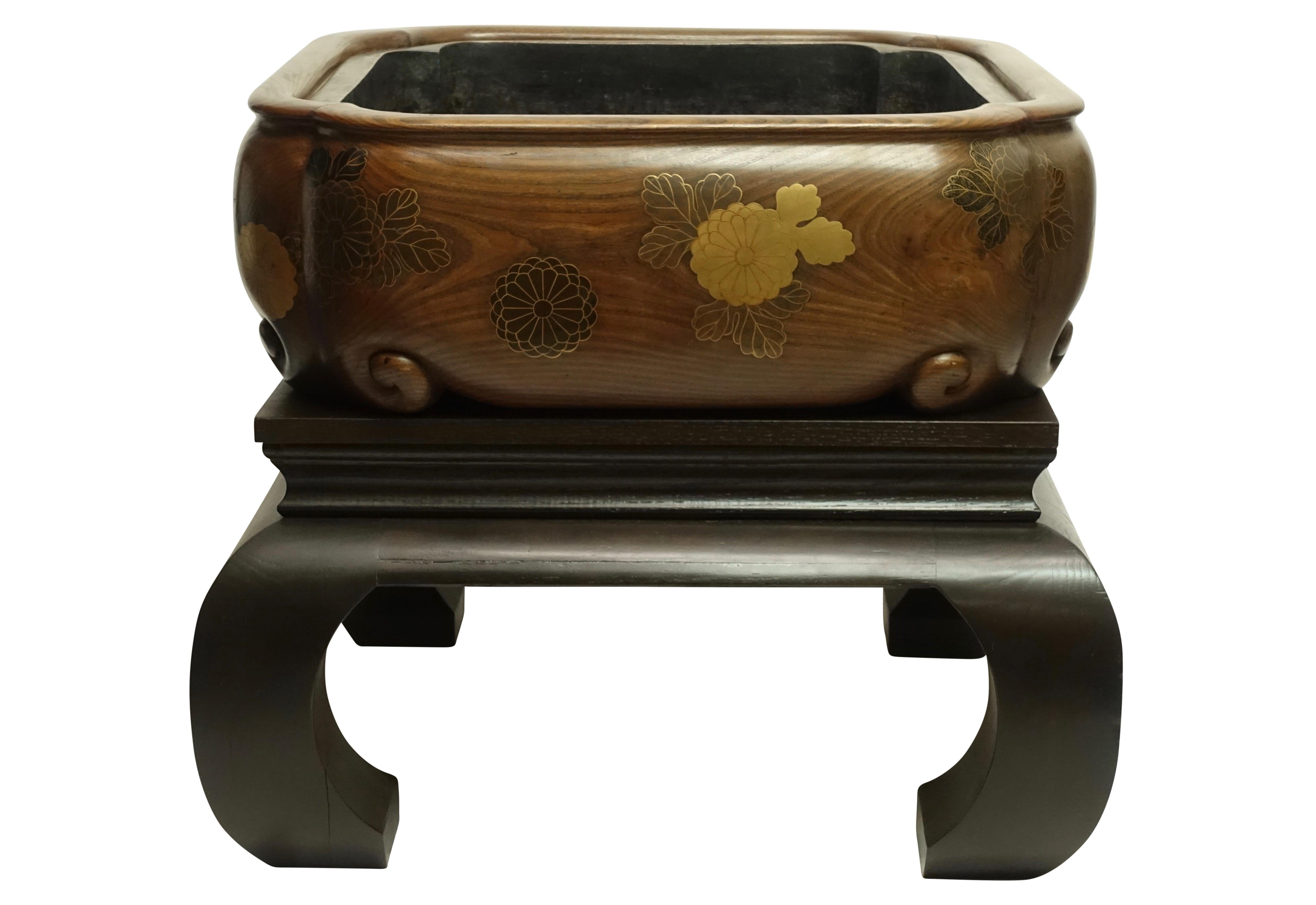 Extremely fine quality and very large size hibachi with original copper liner. Lacquer over solid chestnut with custom made stand. Japan, late 19th century.
