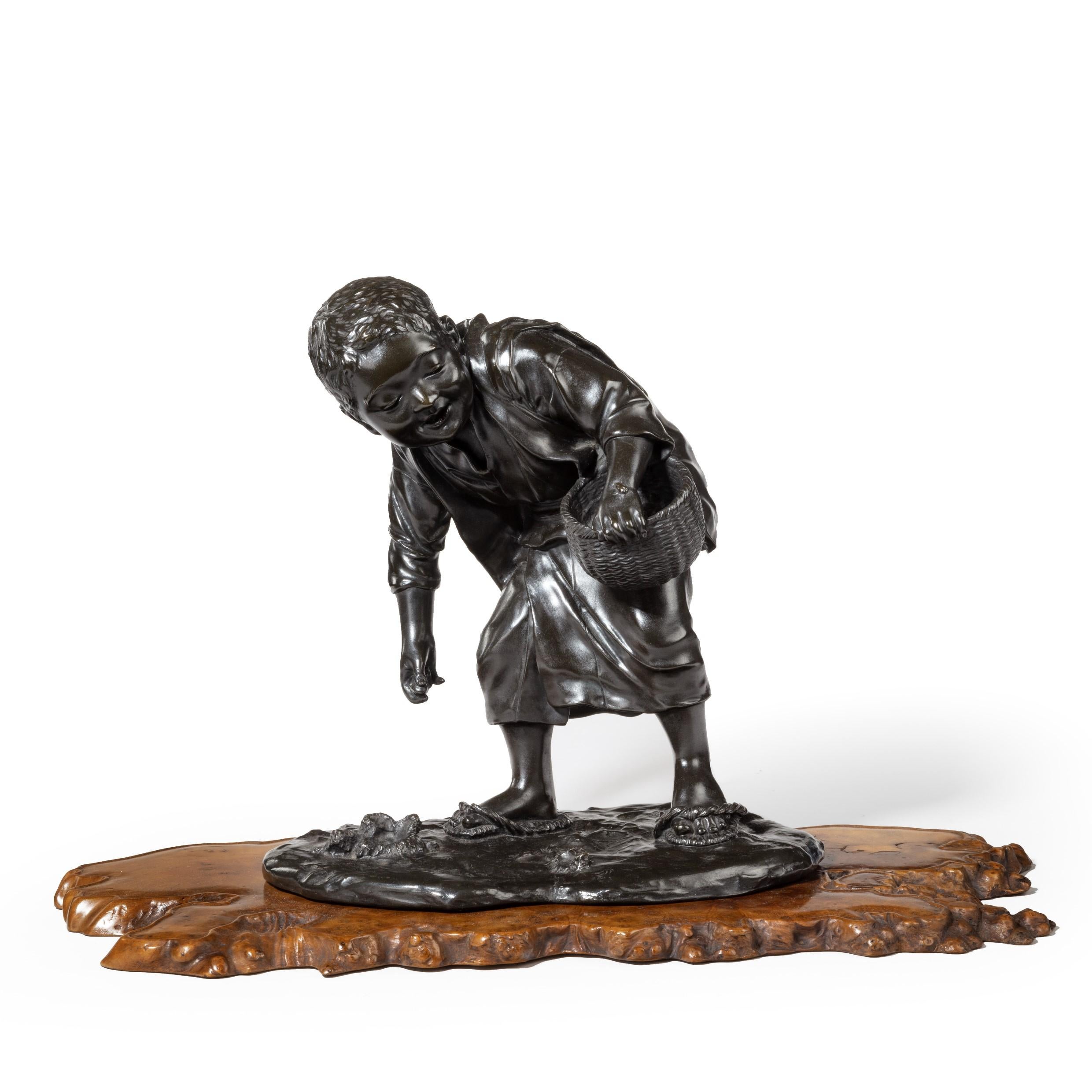 Japanese 19th Century Meiji Period Bronze of a Boy Collecting Sweet Chestnuts by Seiya For Sale