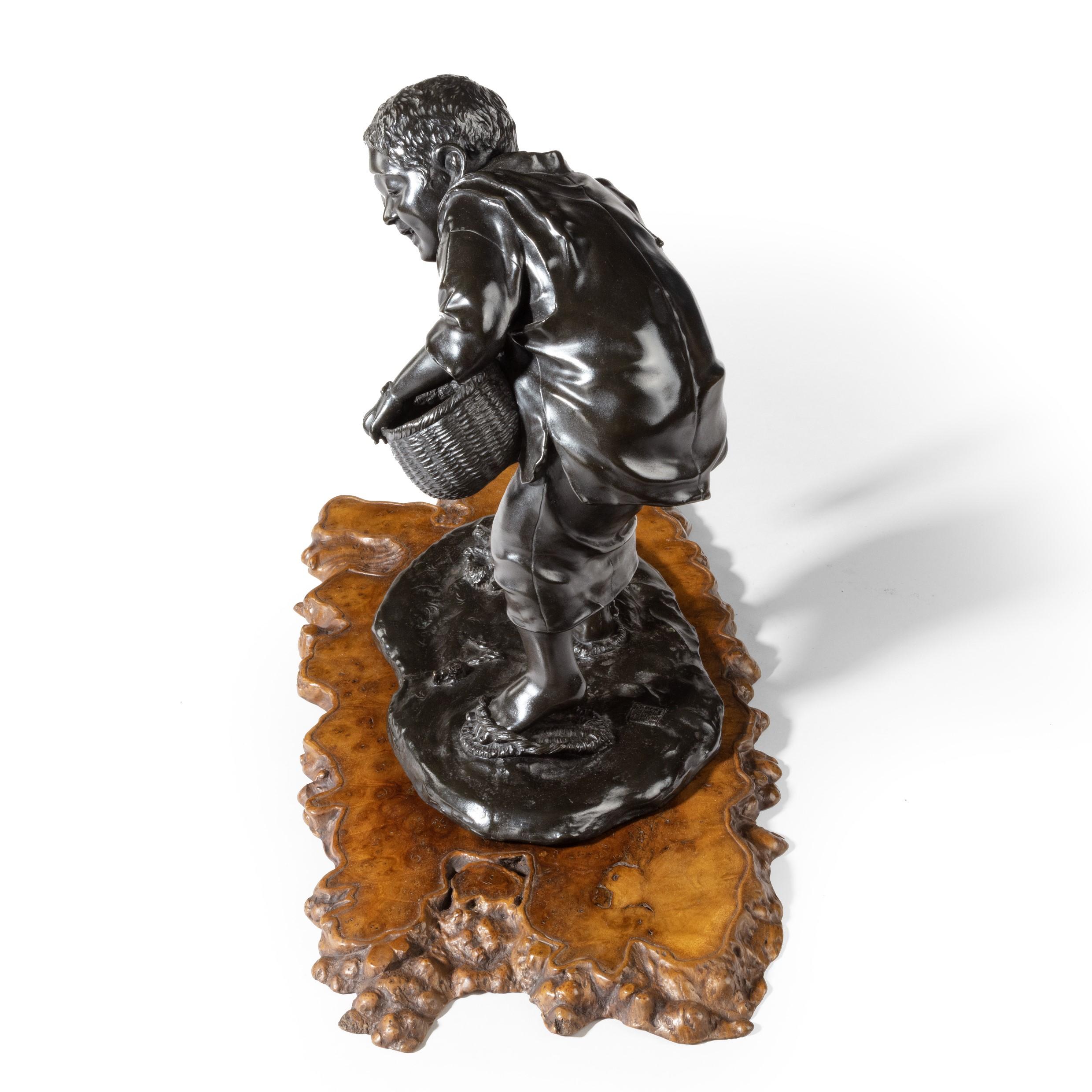 Late 19th Century 19th Century Meiji Period Bronze of a Boy Collecting Sweet Chestnuts by Seiya For Sale