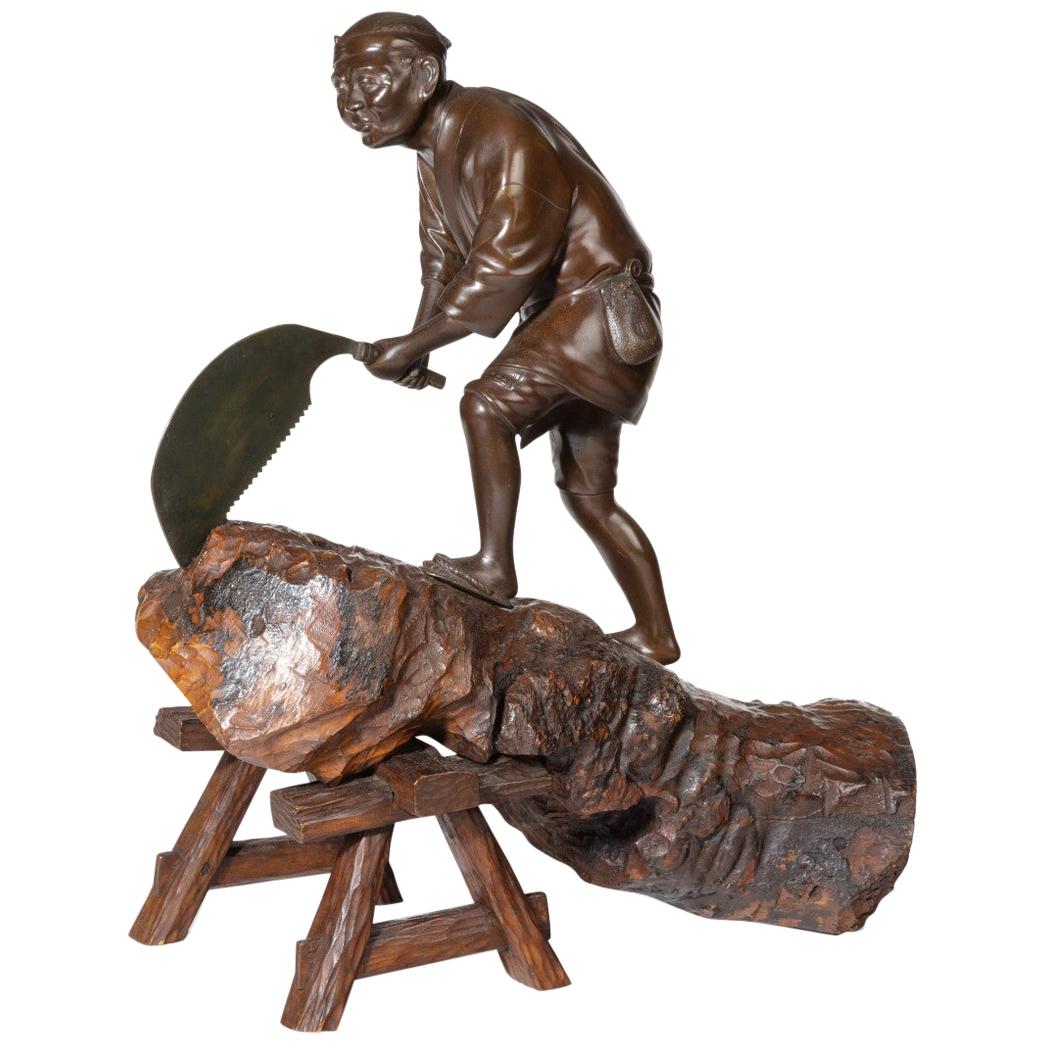 19th Century Meiji Period Bronze of a Woodcutter Sawing a Large Tree Trunk