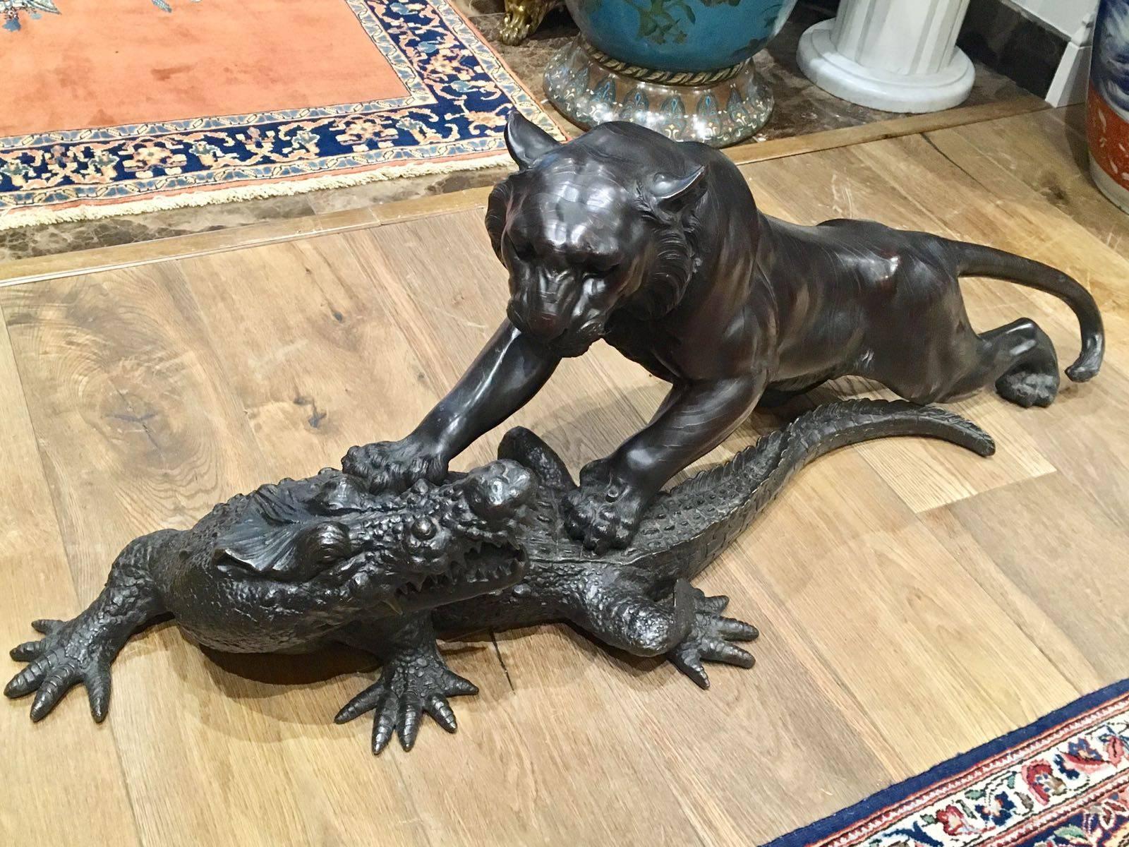 19th century, Meiji period, Japanese bronze sculpture of a tiger and crocodile. 

When the two pieces are fitted together they measure 44 cm in height and 118 cm in length. 

The tiger and crocodile can be separated, and when separated, the