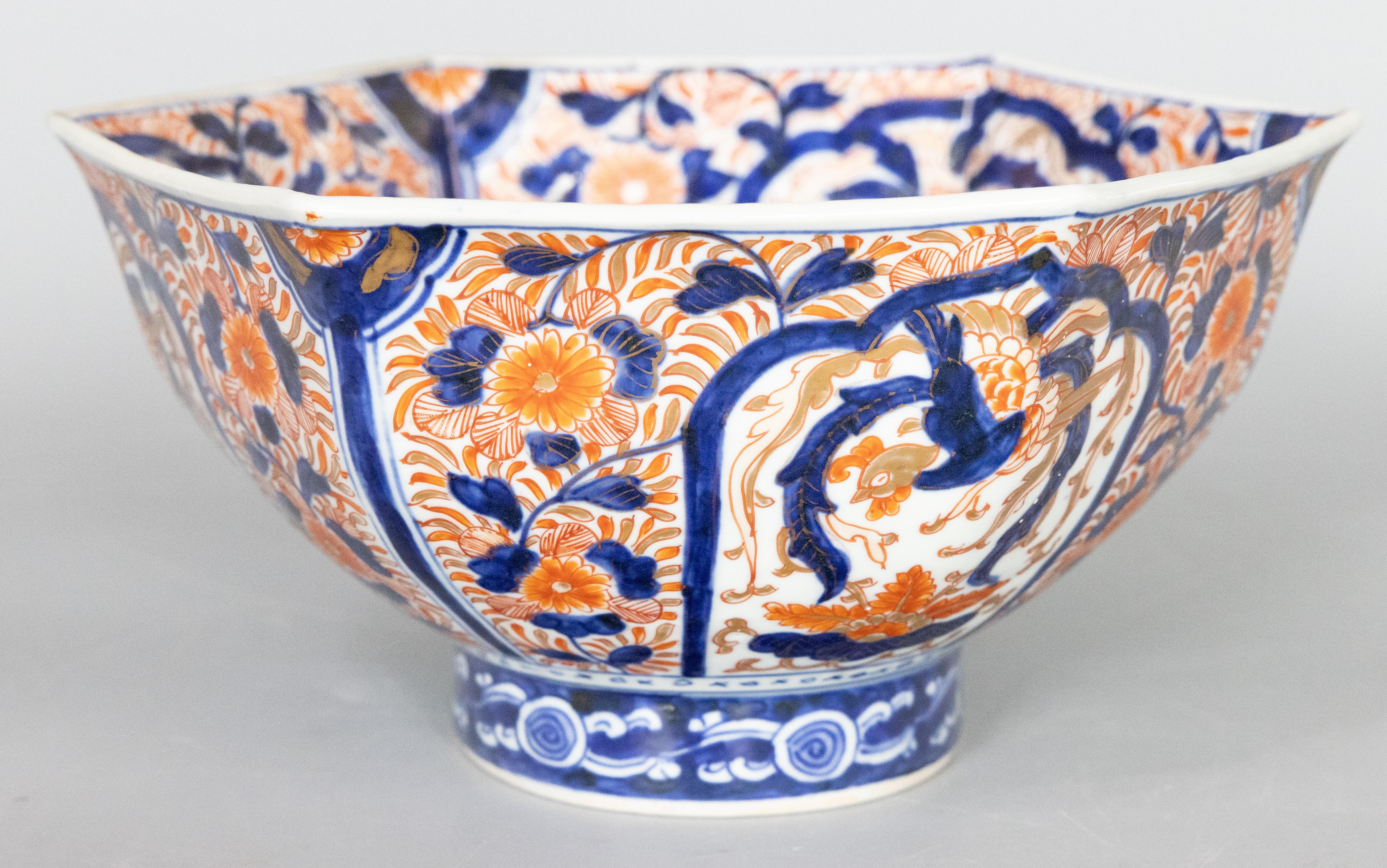 A gorgeous 19th-Century Japanese Imari porcelain hexagonal pedestal centerpiece bowl, circa 1870. This fine bowl has a stylish hexagonal design and lovely handpainted floral motif in the traditional Imari colors, and it displays beautifully.