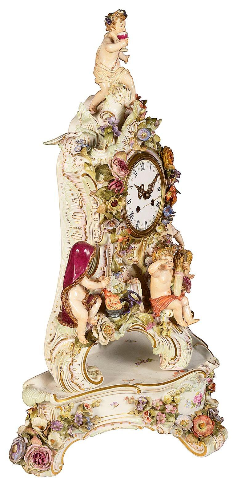 A fine quality late 19th Century German, Meissen porcelain clock on stand, having wonderful bold traditional colours, the figures representing the four seasons. The clock striking on the hour and half hour.  
 
 
Batch 73 61385. SZKZE