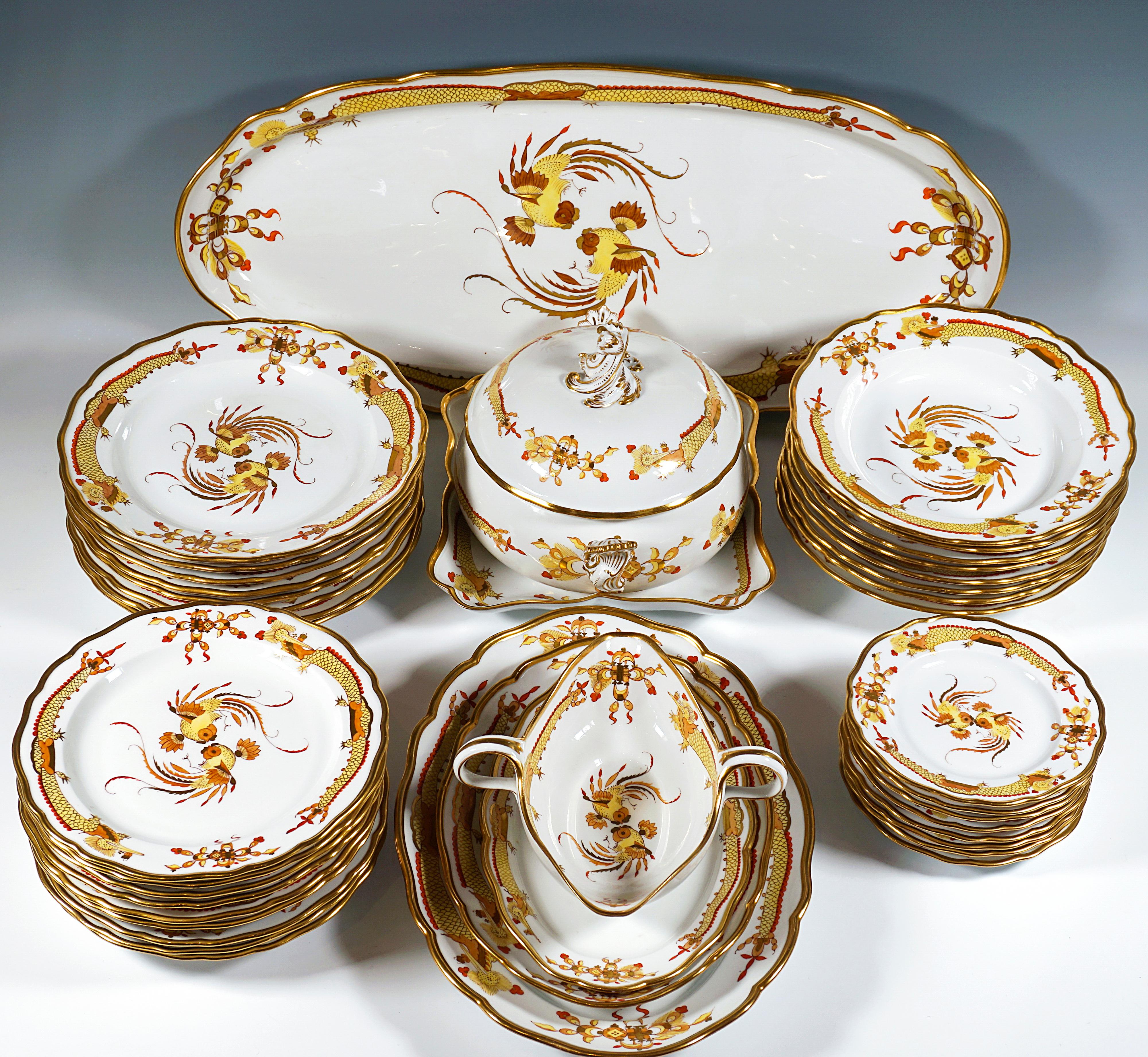 Meissen Dining Set for 8 Persons
Decor: Rich dragon yellow - shaded red & gold, gold rim; fine, detailed overglaze painting
Shape: New cut-out
Decor number new: 321610

40 parts:
1 Large oval plate  - l x w  =  24.01 x 11.81  in
1 Lidded tureen     