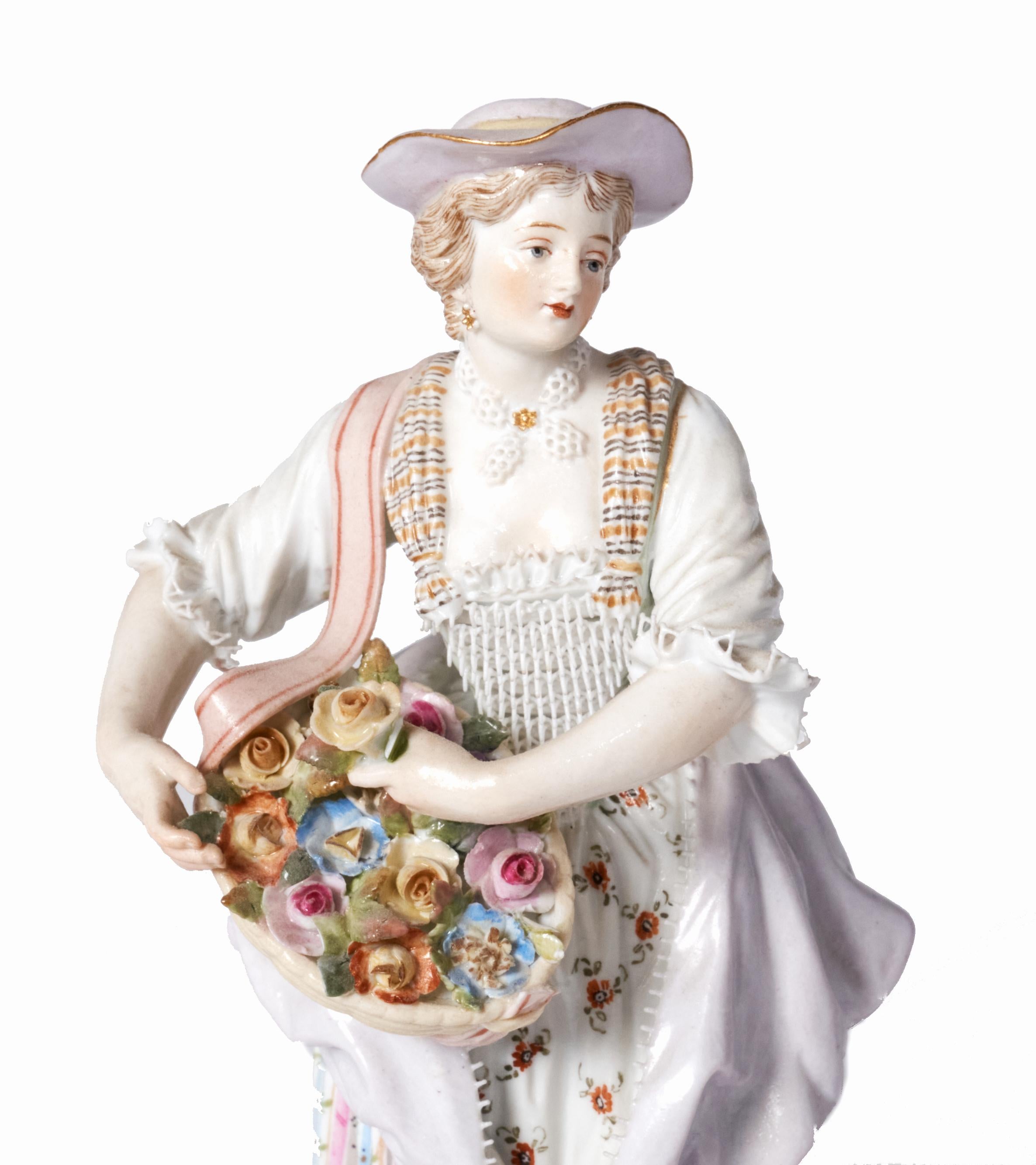 Lovely example of Meissen at it's best. This figurine of a beautiful woman with a basket of flowers is incredibly detailed. From the lace trim on her dress to the tiny flowers in her basket she is in excellent condition without cracks, chips or