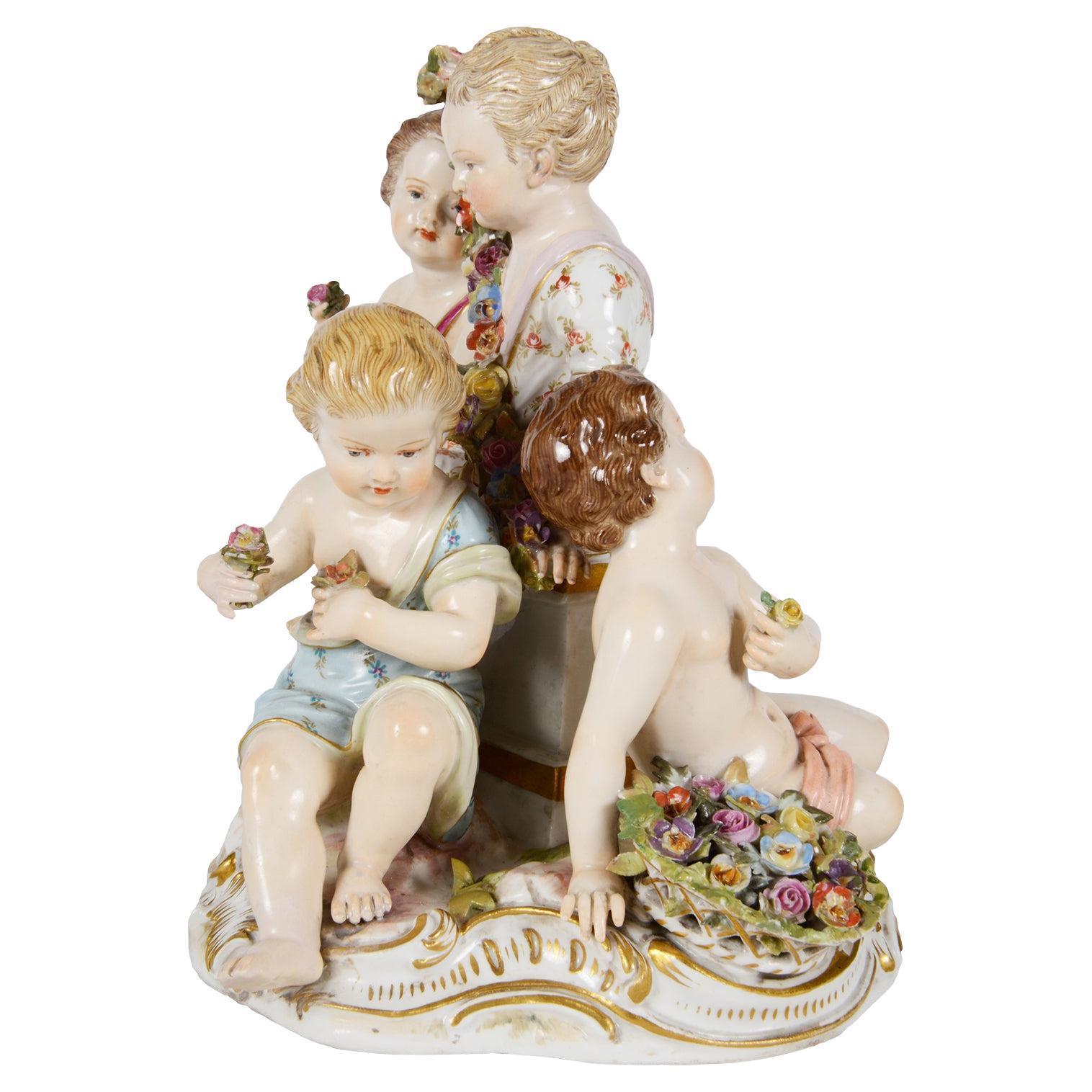 An enchanting fine quality 19th Century Germany, Meissen Porcelain group of four children representing 'Spring' Having wonderful bold colouring and a blue crossed swords signature to the base.