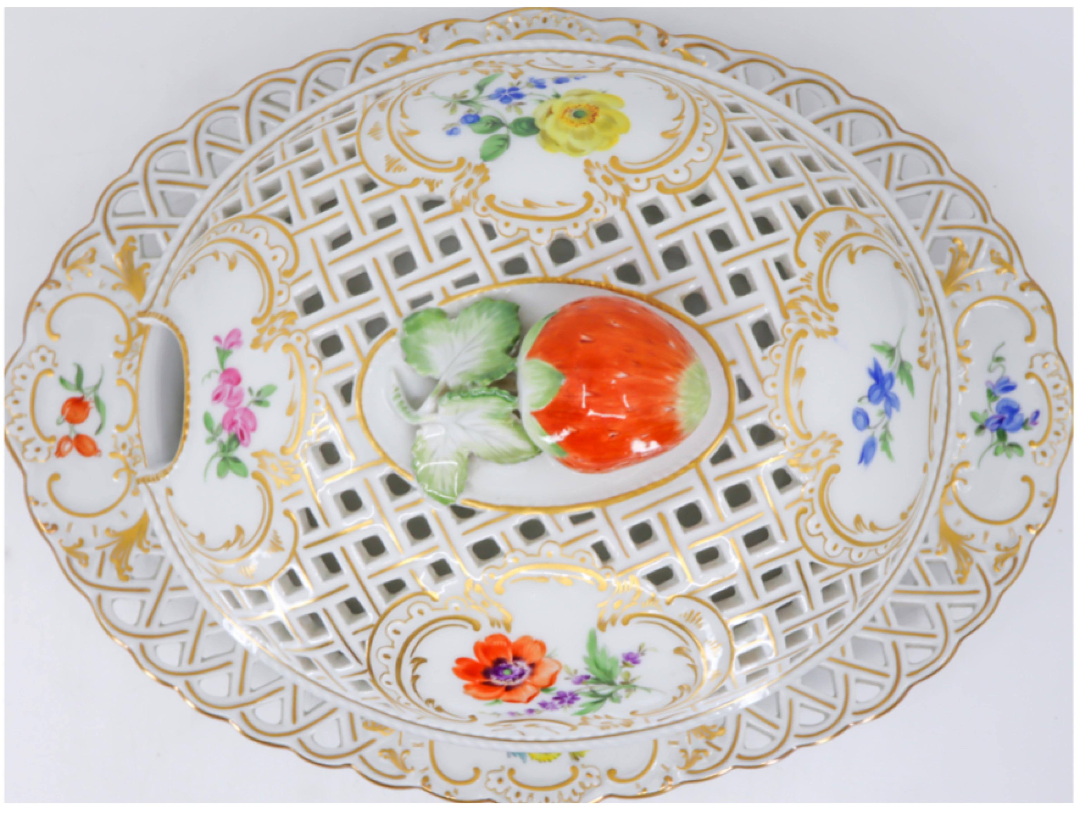 German hand painted porcelain bowl with flowers, the lid of the bowl has a strawberry finial, finely painted with flowers enclosed in cartouches on both lid and plate with open work, gilded pattern throughout. Opening for spoon insert on the lid
