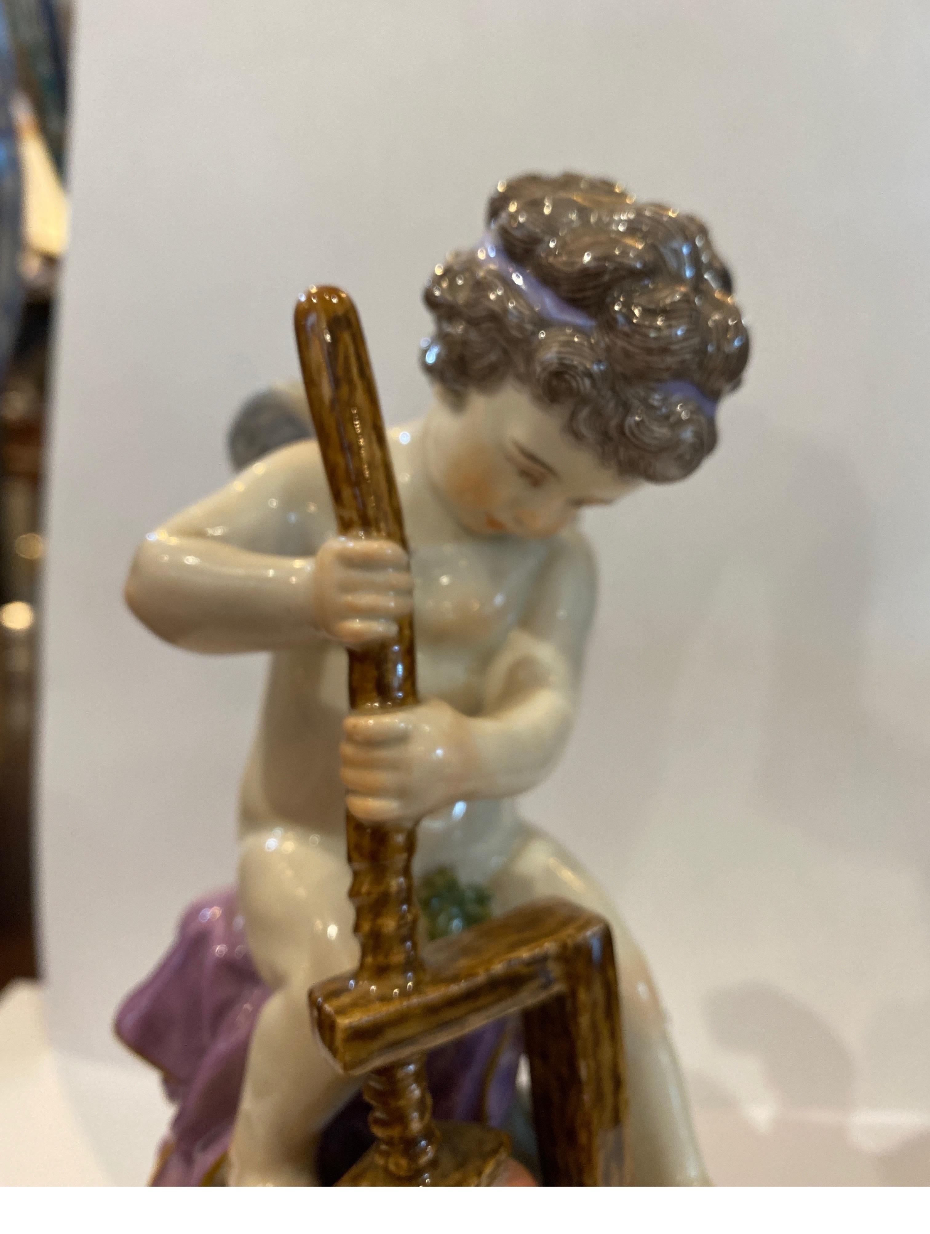 19th Century Meissen porcelain figure modeled to show the young putti with a cheese press, sat on a naturalistic rocky outcrop raised on circular base. Underglazed crossed swords mark and incised mark L107 to underside of base.
The mark with