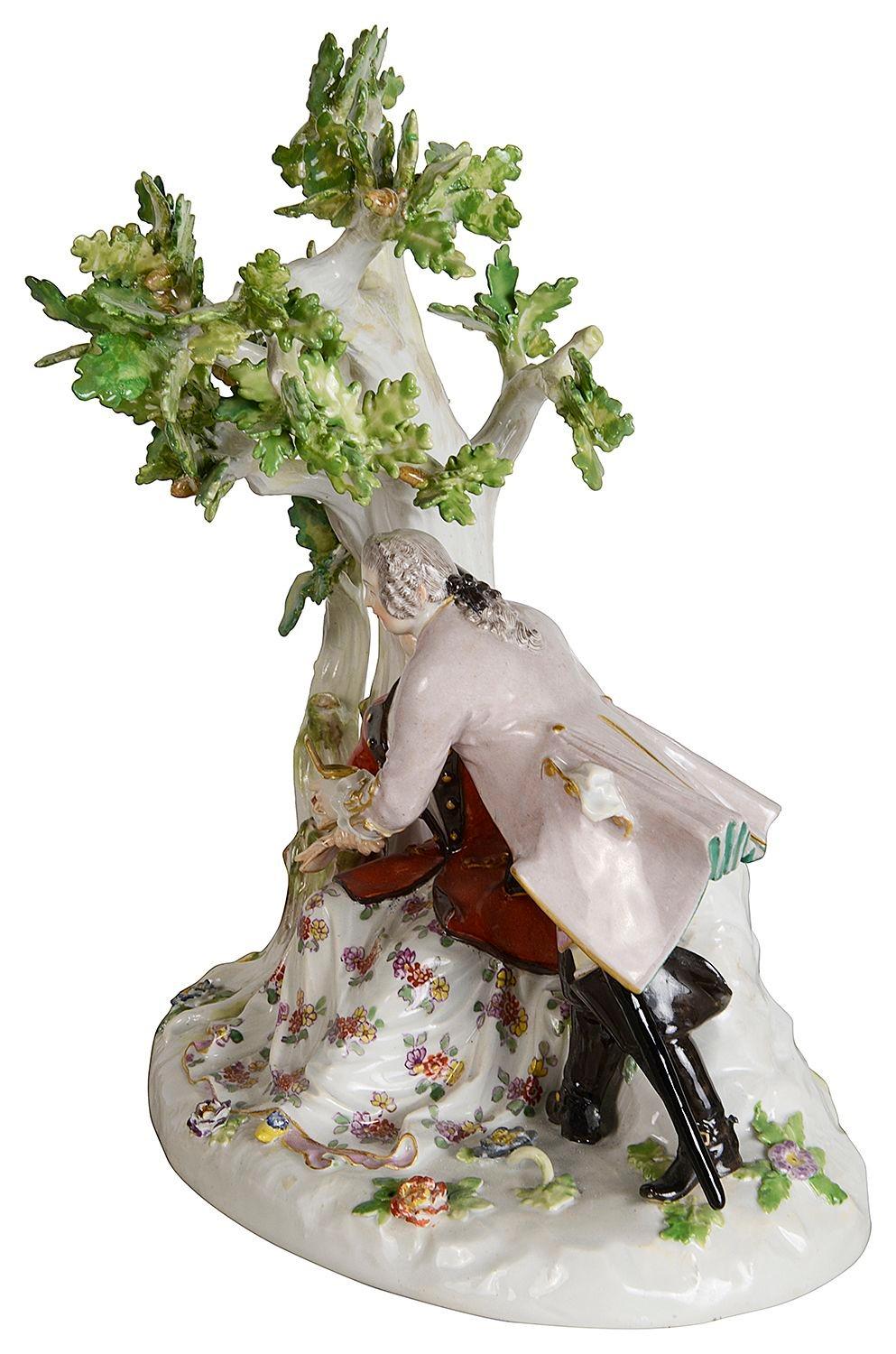 An enchanting Meissen porcelain group of lovers under a tree.
Blue crossed swords to the reverse.

Batch 81 N/H
