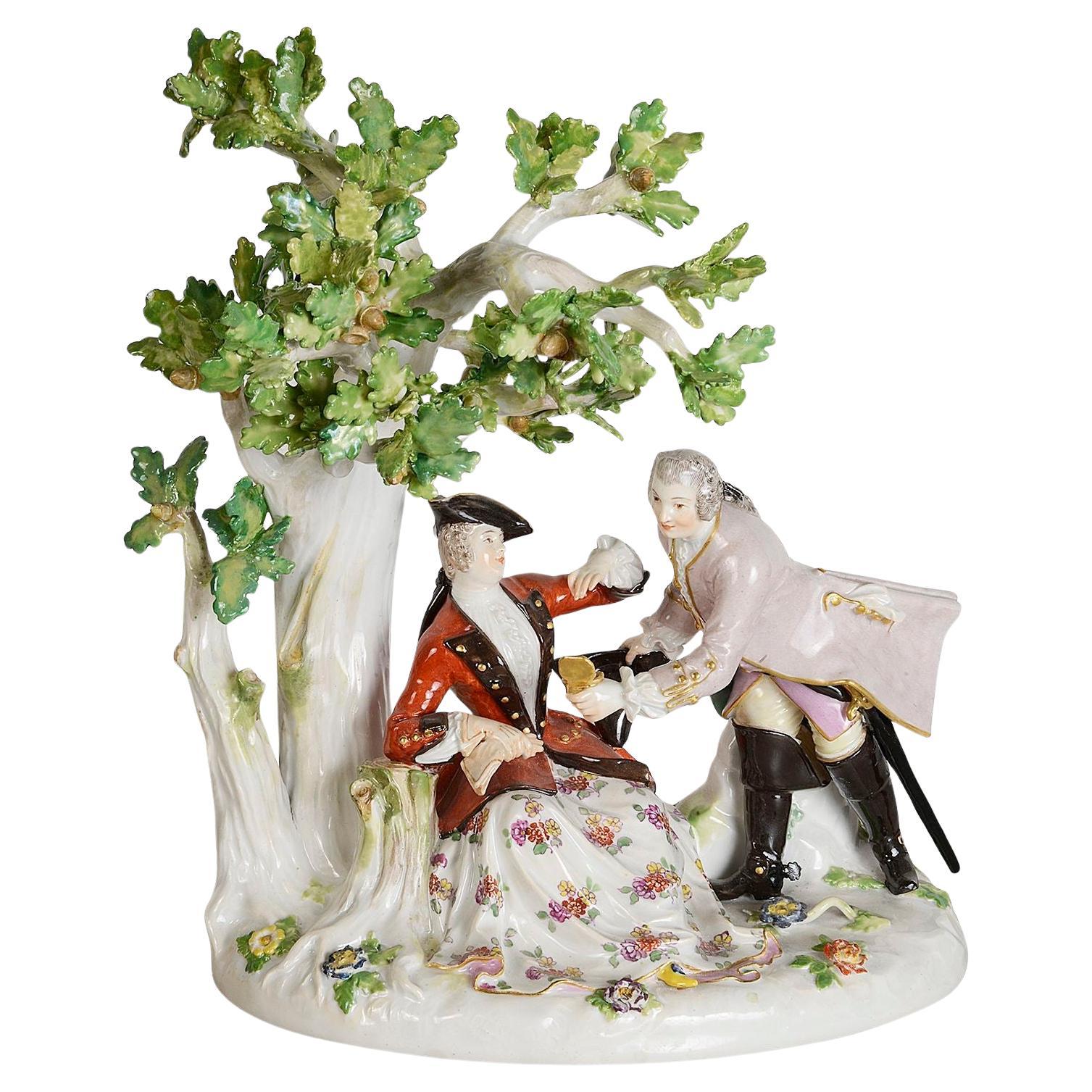 19th Century Meissen porcelain group of lovers under a tree.