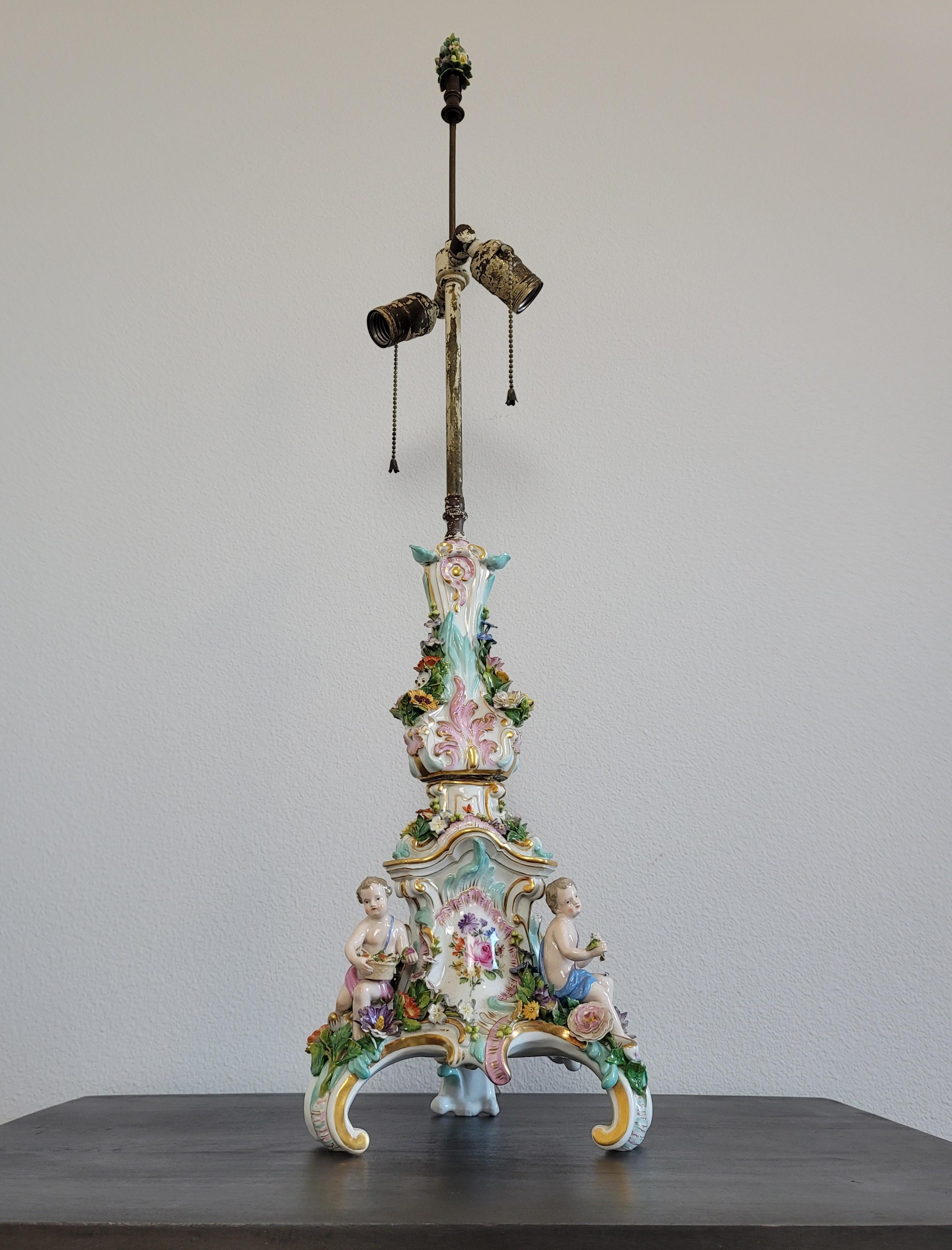 A stunning antique, circa 1880s, Dresden porcelain figural flower encrusted candlestick - candelabra mounted as a lamp. 

Exquisitely handmade and painted in Germany in the late 19th century, developed by Ernst August Leuteritz, the very finest of