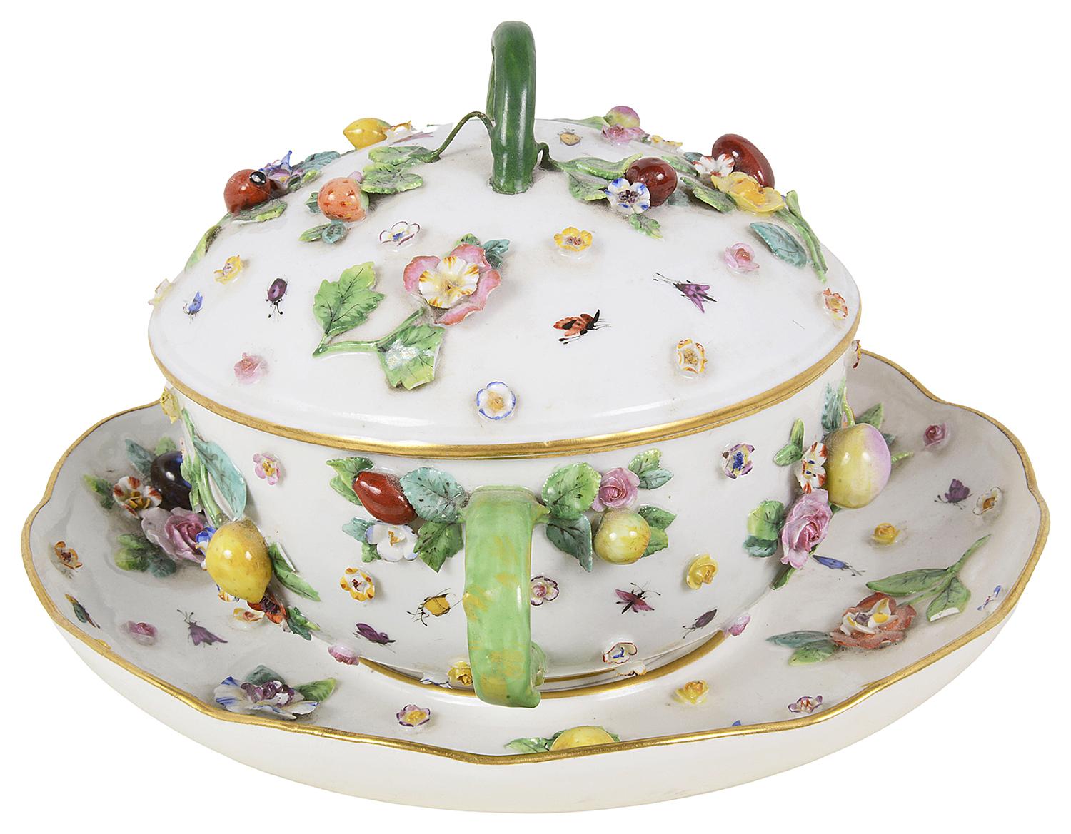A fine quality 19th century Meissen Porcelain lidded tureen, having wonderful bold coloured raised floral decoration, berries and insects.
Underglaze blue cross swords to the underside.