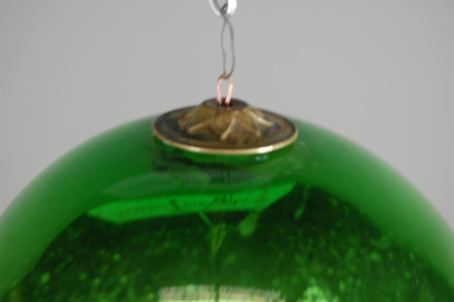 Heavily foxed original Mercury glass witches ball, Rare green colour, wonderful condition with dramatic heavy foxing, France, circa 1880.