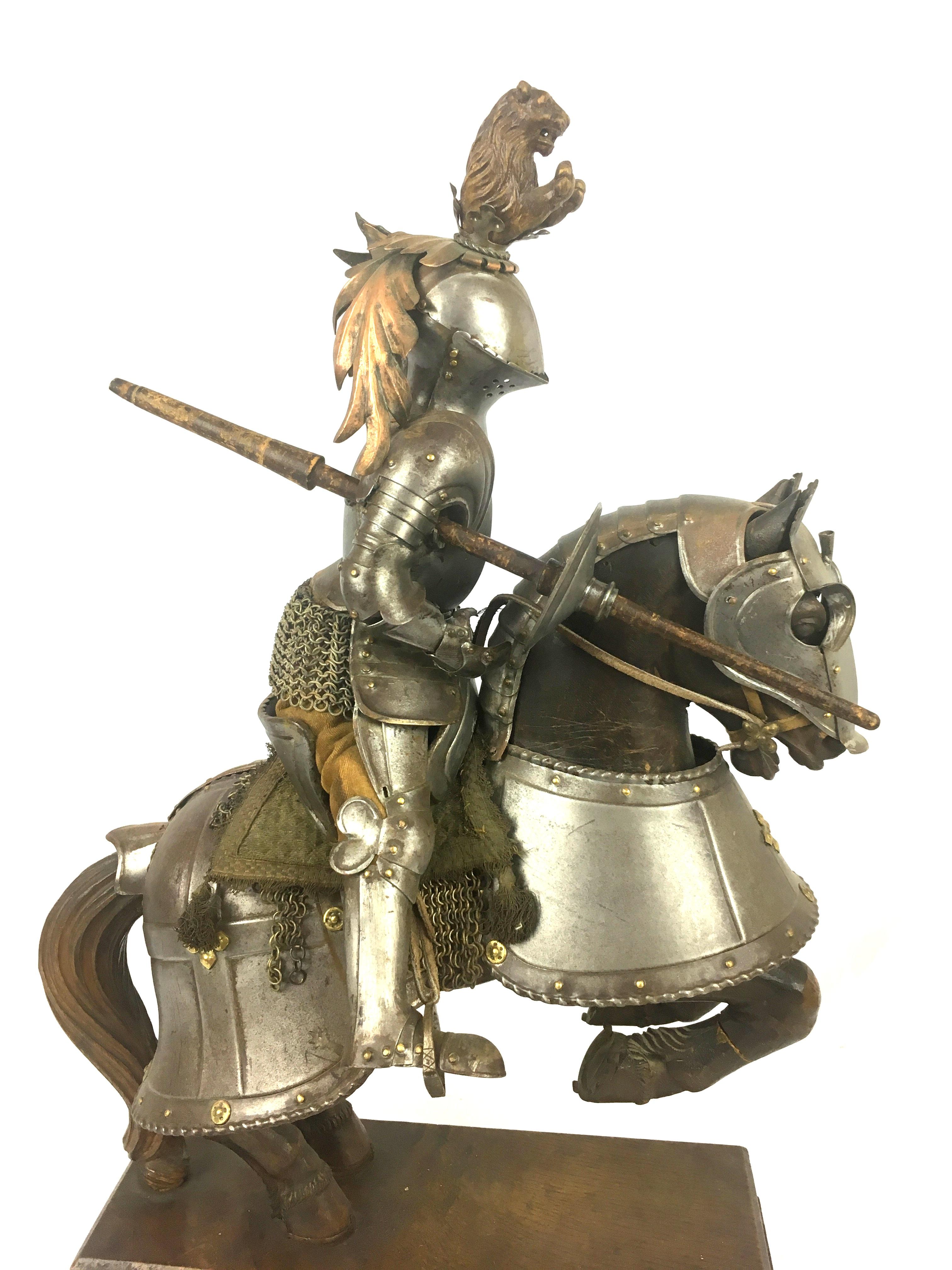 19th century carved wooden horse in armor bearing an armored baronial knight with lance. It measures 19 ½ inches overall height, 13 ¾ inches long and is 7 ½ inches wide.

The knight wears the regalia of a man of rank, including carved wooden