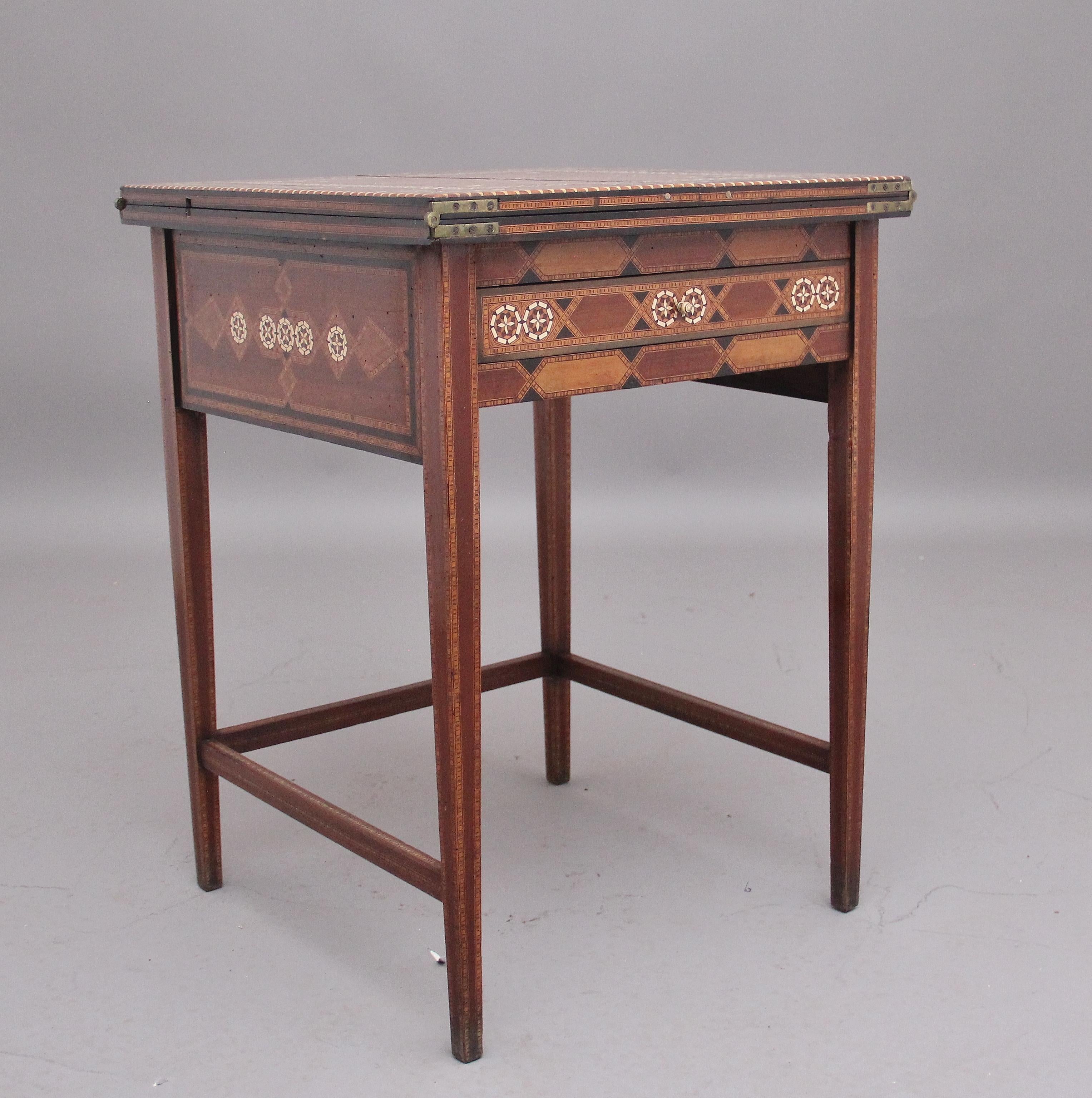 19th Century metamorphic Syrian writing table, the duel hinged top lifting up and folding over to reveal the rising writing desk top to reveal a green baize writing surface, various drawers and compartments, the whole table is profusely inlaid all