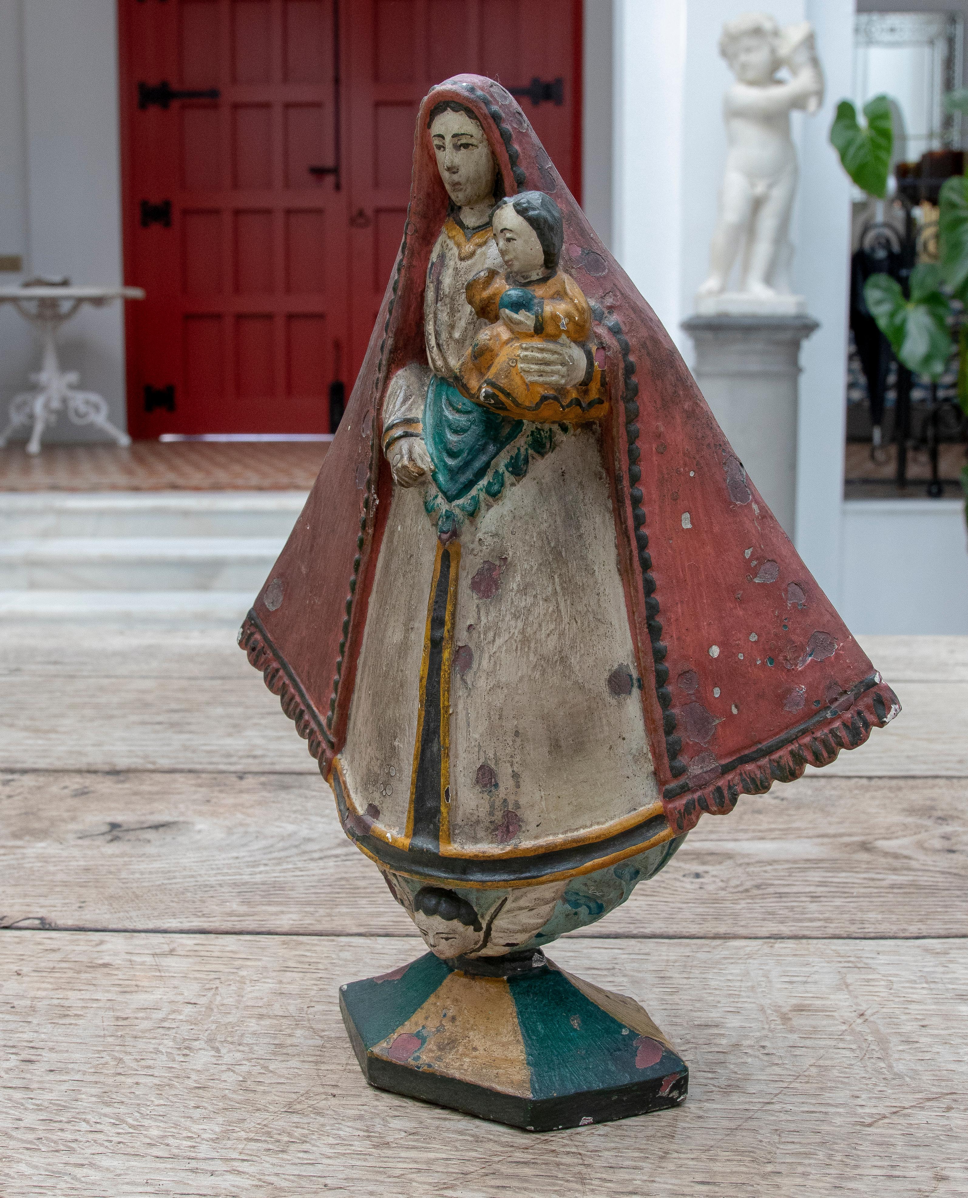 19th Century Mexican wooden hand-painted virgin with child in arms.