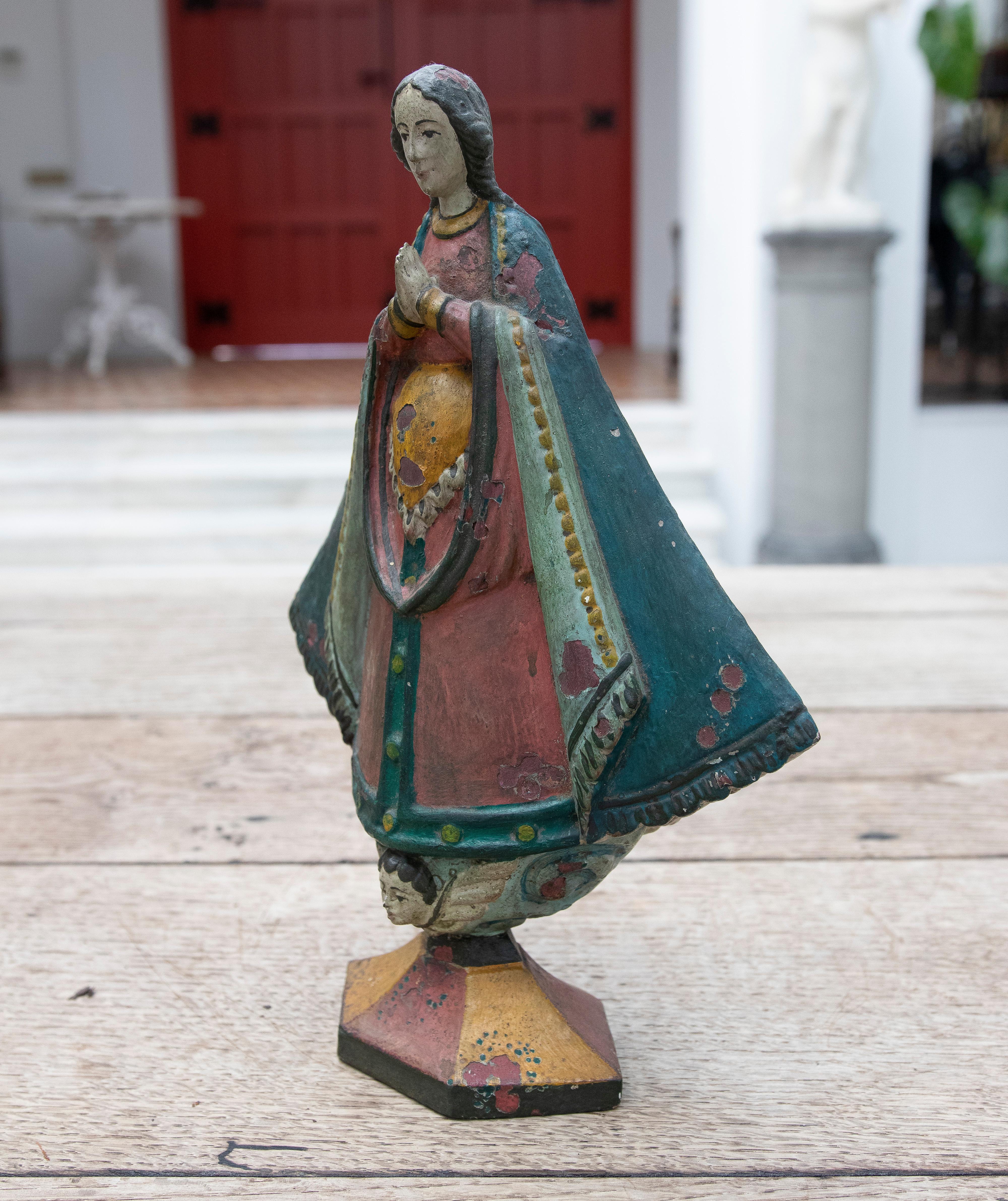 19th century Mexican wooden hand-painted virgin with child in arms.