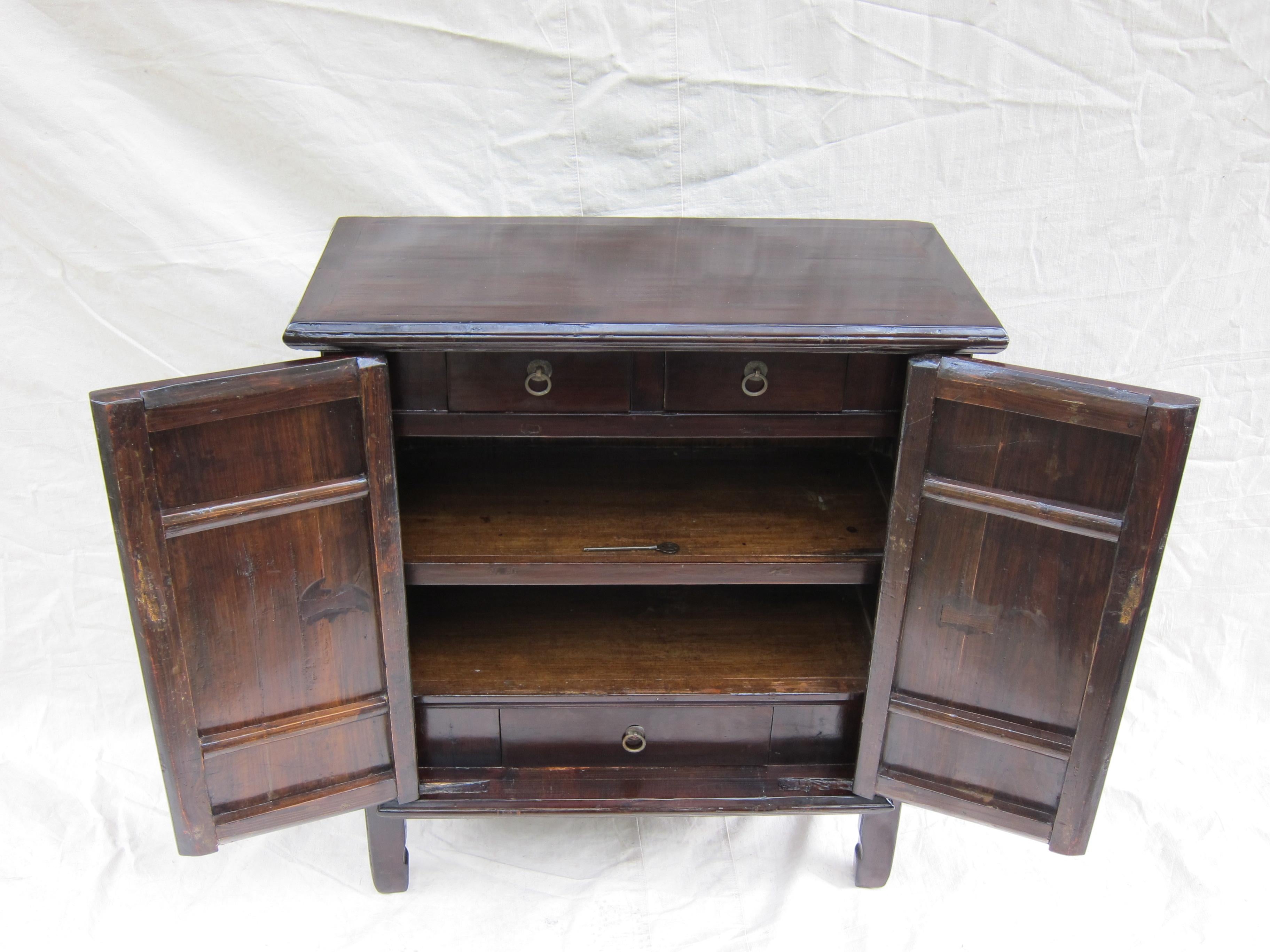 19th century Chinese middle cabinet. Middle cabinet having two upper drawers and middle and lower shelf storage inside. Very good condition. Attractive size can be placed in narrow or tight areas. Good for everyday use. 
  