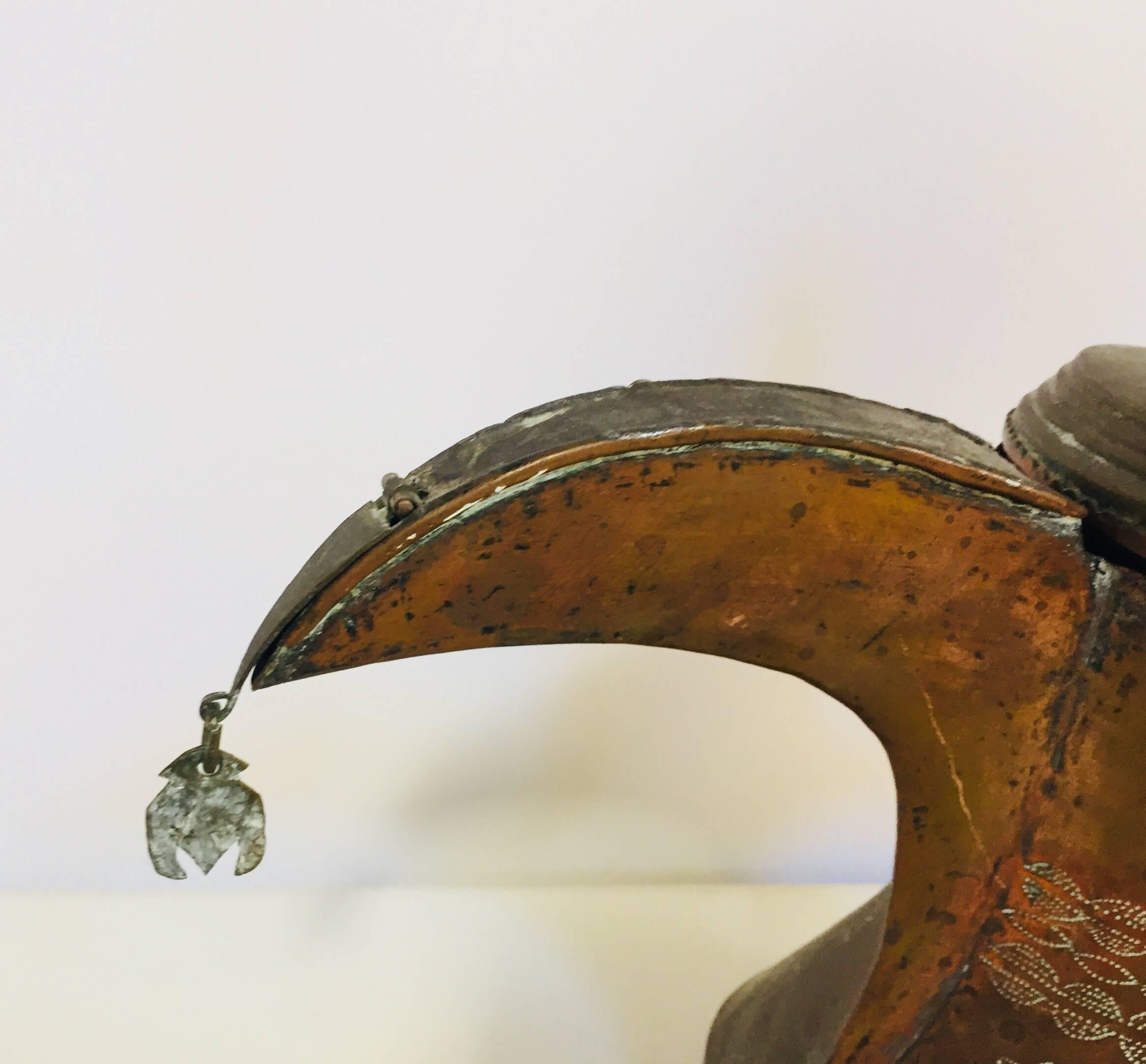 19th century Middle Eastern traditional Arabian tinned copper and brass Dallah coffee pot. 
Coffee pot hand-hammered and chased copper with riveted brass finish and a very large spout. 
Size: 12