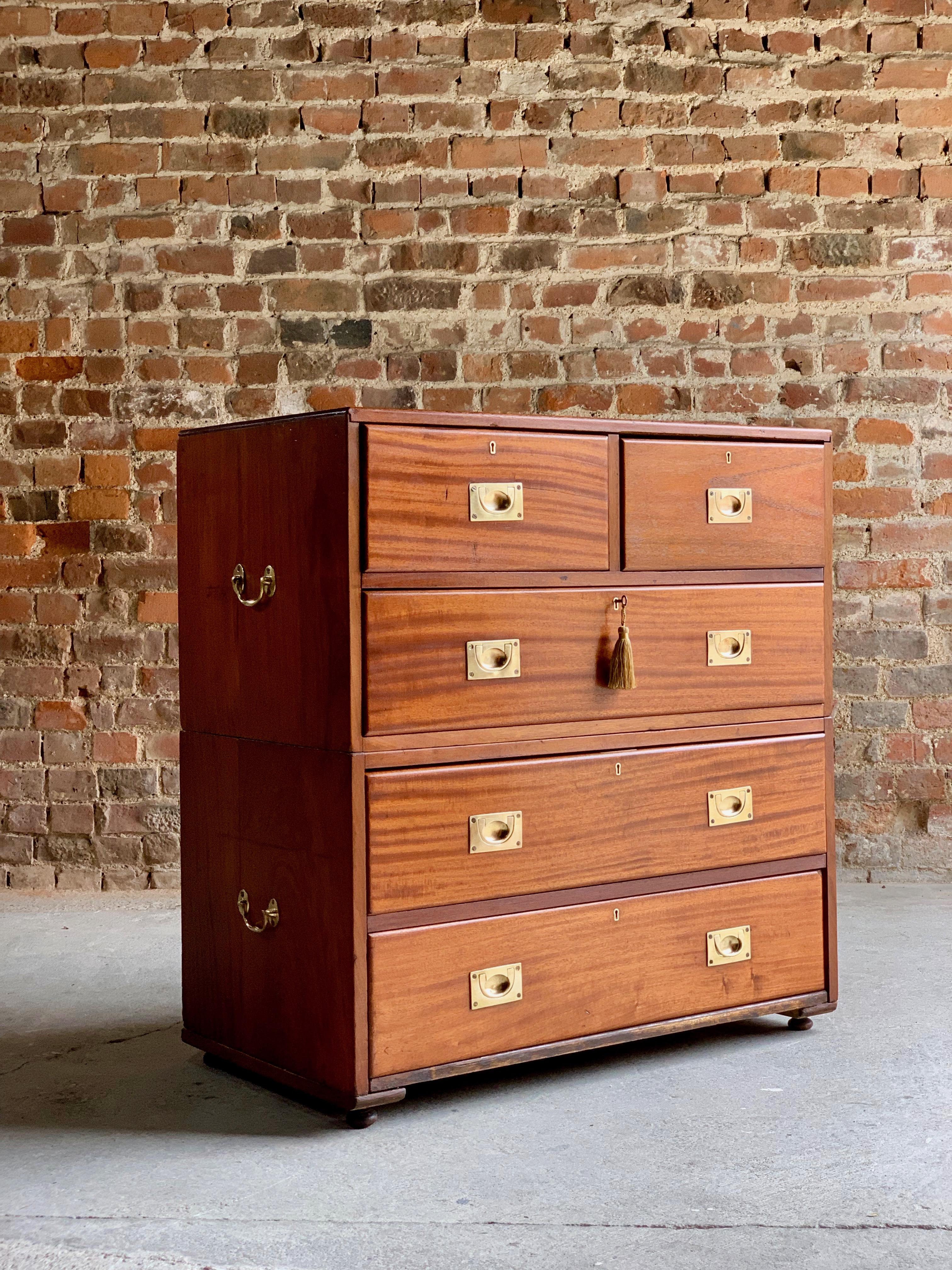 19th century military campaign chest of drawers in Teak, circa 1870 No: 23

A 19th century military campaign teak chest of drawers circa 1870, the rectangular top over two short and three longer graduated drawers, all fitted with campaign brass