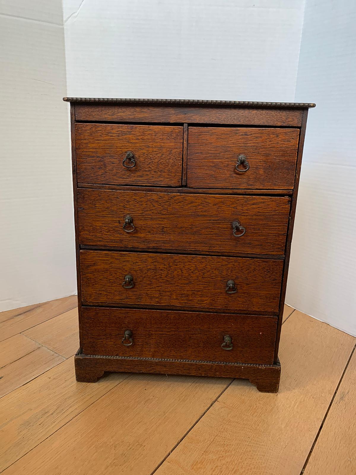 19th century miniature American oak chest with five drawers
Small, accessory size. Likely used as a model for traveling salesmen.