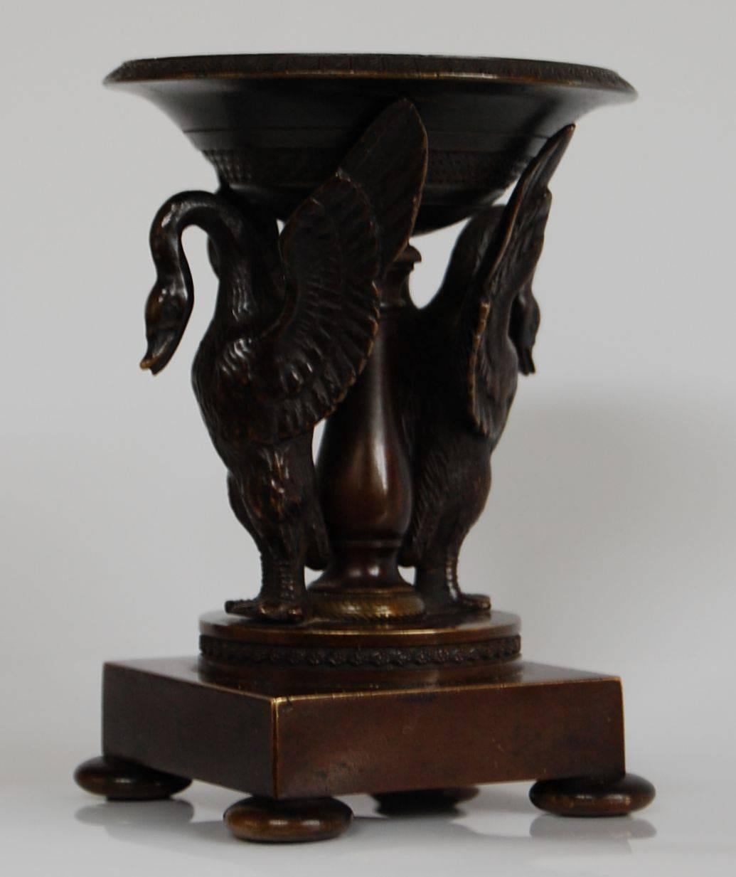 Bronze incense burner supported by two Herons on a raised square base with bun feet. Very fine etchings in excellent condition.