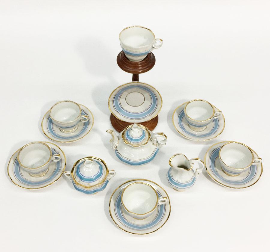 19th century Miniature Childs Porcelain tea service

9 pieces Miniature Porcelain, not marked 
Tea pot, a lidded sugar bowl, a milk jar, 6 cups and saucers 

19th century, probably German
Beautiful white porcelain with blue (light blue and
