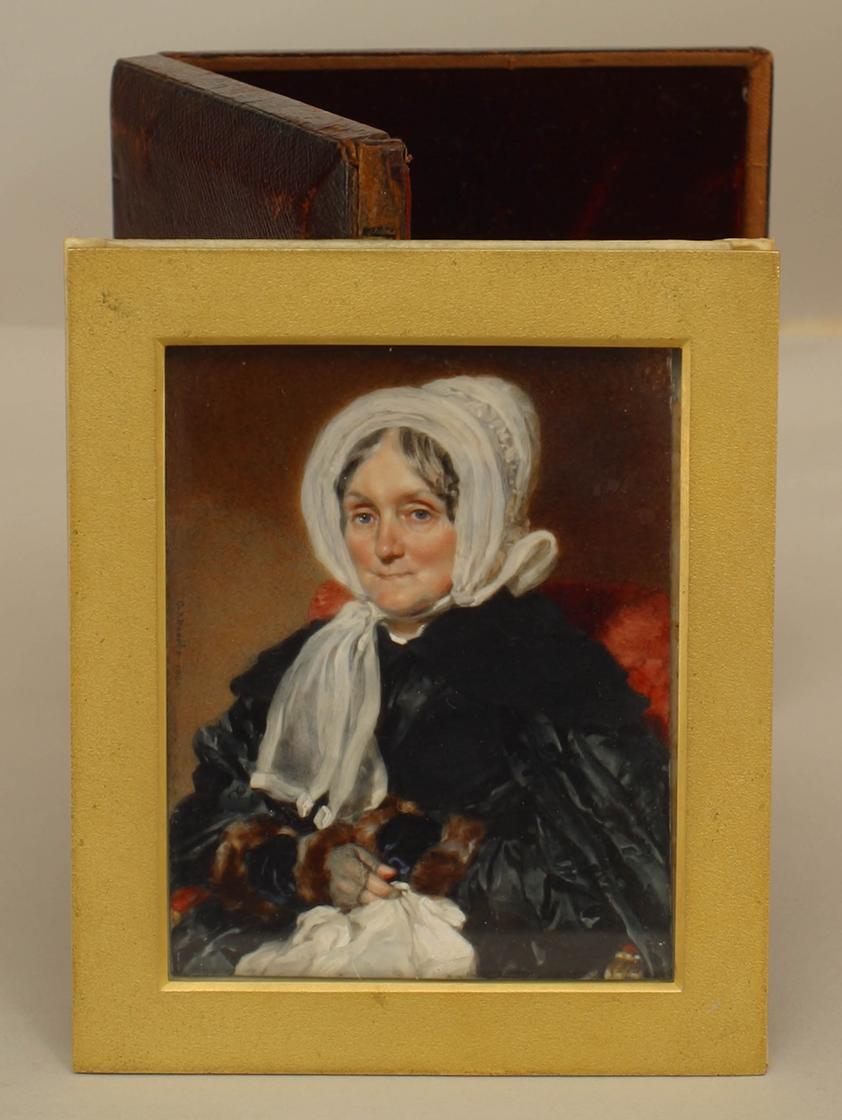 English Victorian miniature oil painting portrait on bone of a seated lady wearing a black dress in leather case (signed: Charles J BASEBE 1841).
 