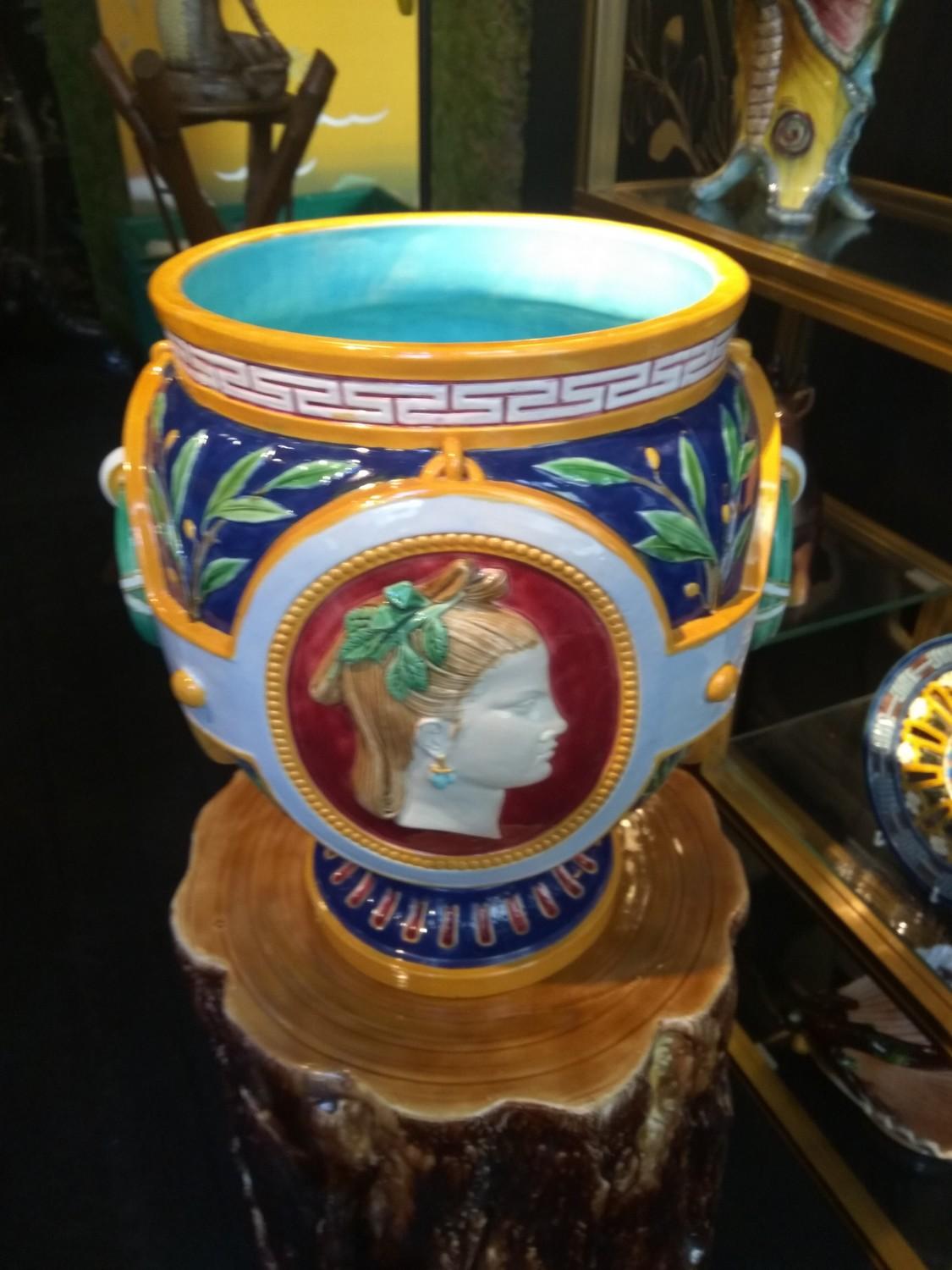 This brightly colored Minton neoclassical vase testifies to the exceptional creative spirit that reigned at the Minton factory during the second half of the 19th century. This planter alone brings together many of the characteristics of