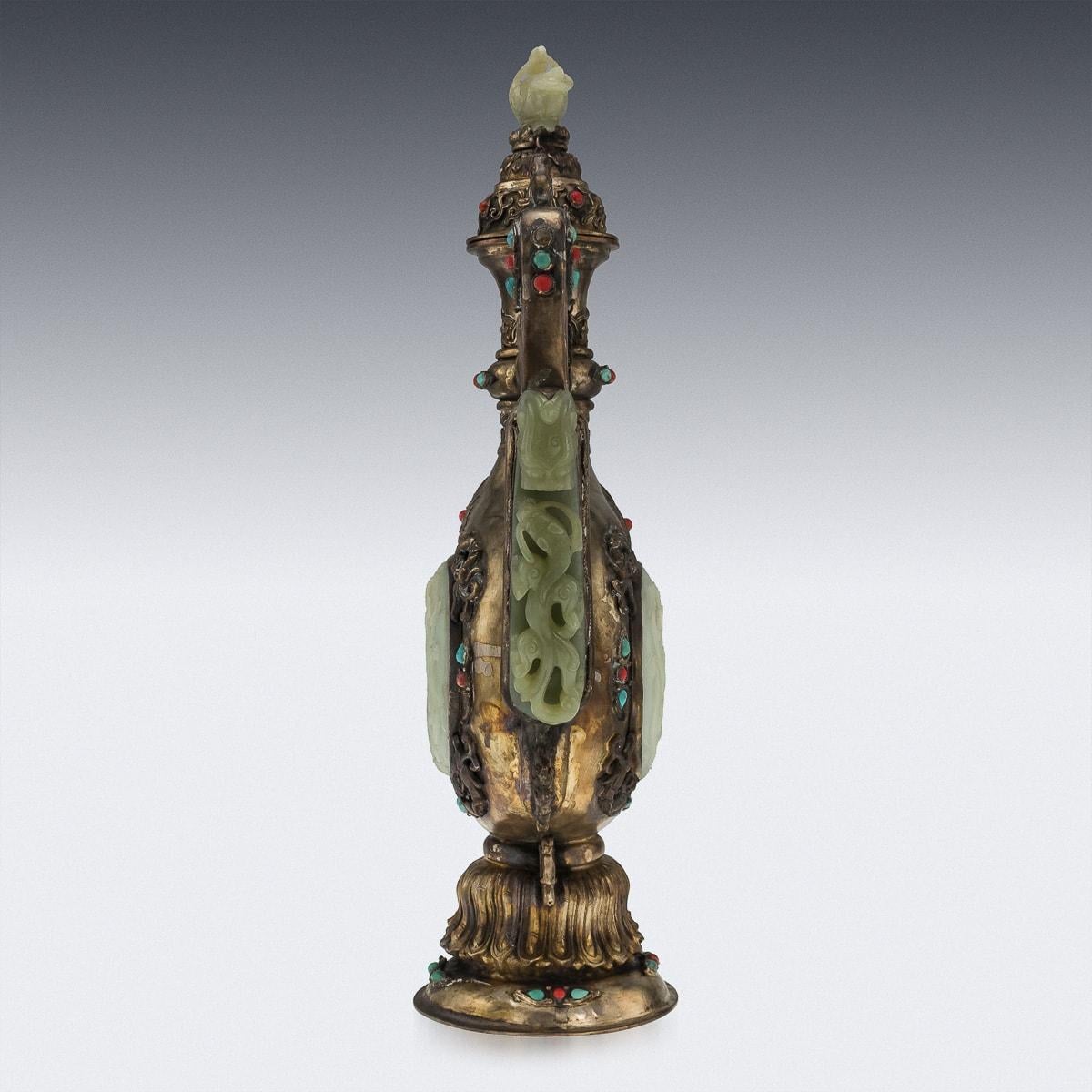Antique 19th century Mongolian-style hardstone and jade-inlaid gilt metal ewer, the pear-shaped body embellished with corals, turquoises and lapislazuli, the large handle mounted with a jade 