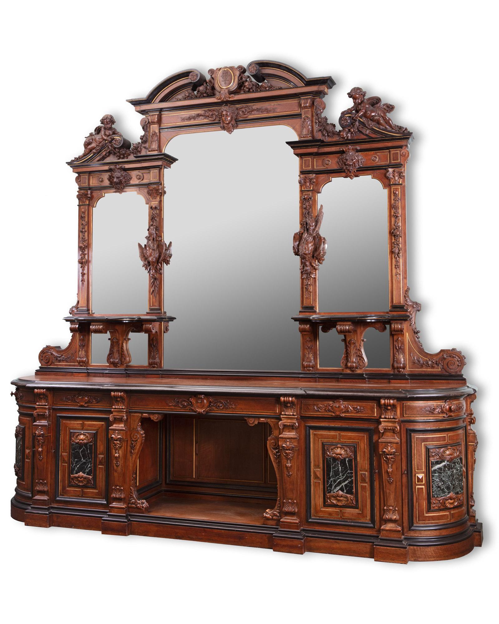 An important and monumental-sized carved Walnut mirrored French buffet by Guéret Frères, Rue Lafayette 216, Paris. Napoleon III style, between 1870 and 1877.

Renowned for their exquisite wood carving, Guéret Frères truly made their statement piece,