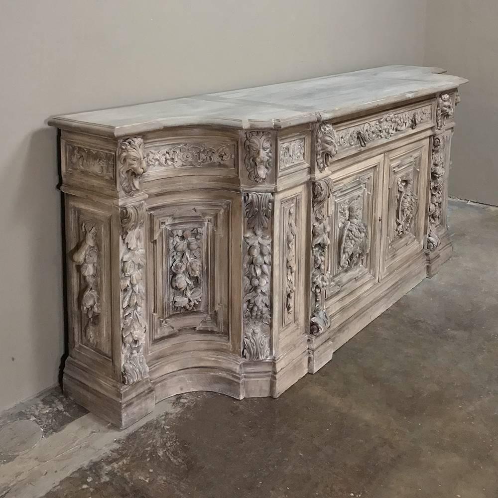 19th century monumental Renaissance stripped oak buffet is a literal feast for the eyes, sculpted on a grand scale for a grand impression! Four panels across the front include two cabinet doors carved in glorious full relief with harvested fowl and