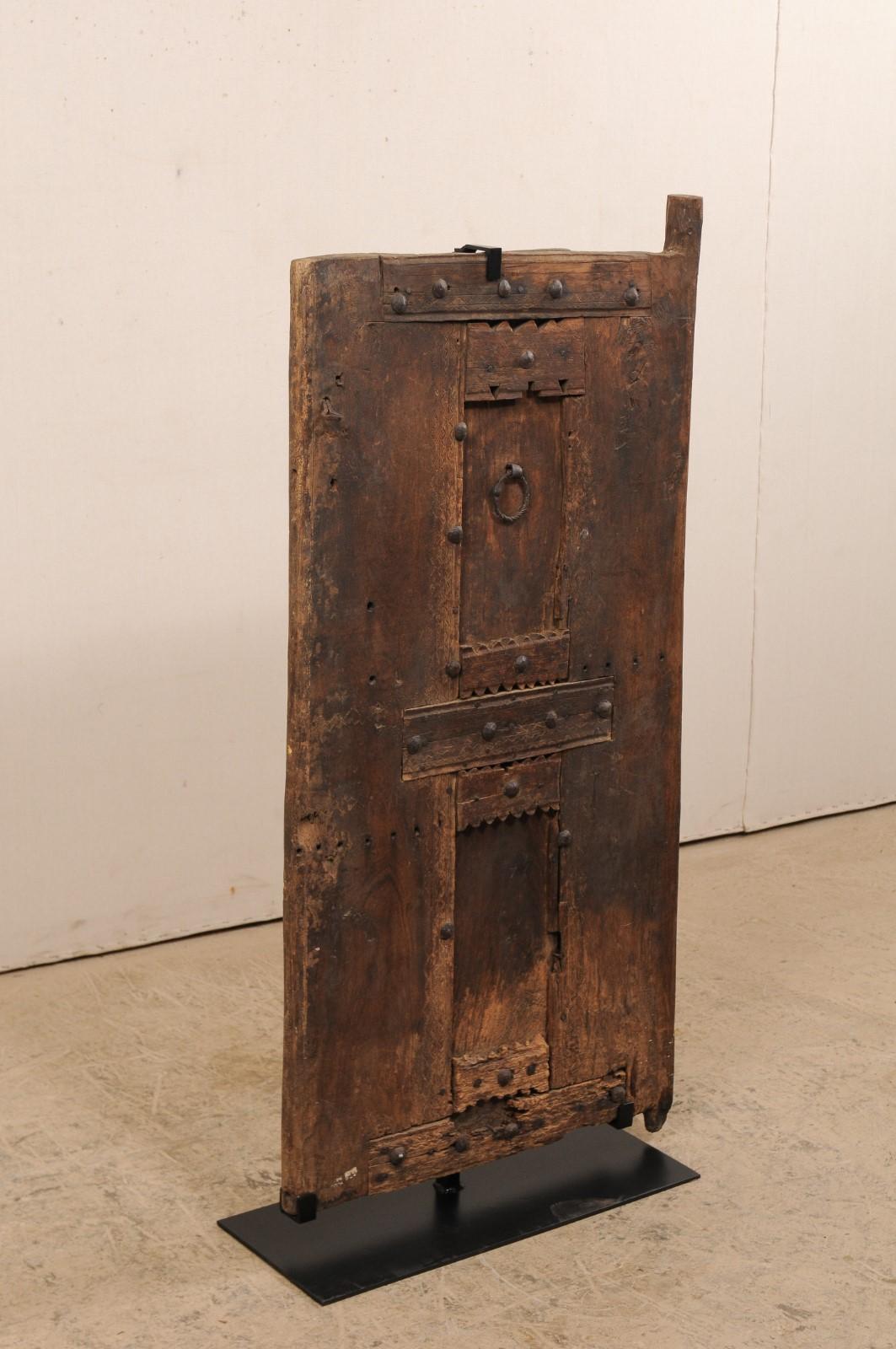 Hand-Carved 19th Century Moroccan Rustic Door On Stand For Sale