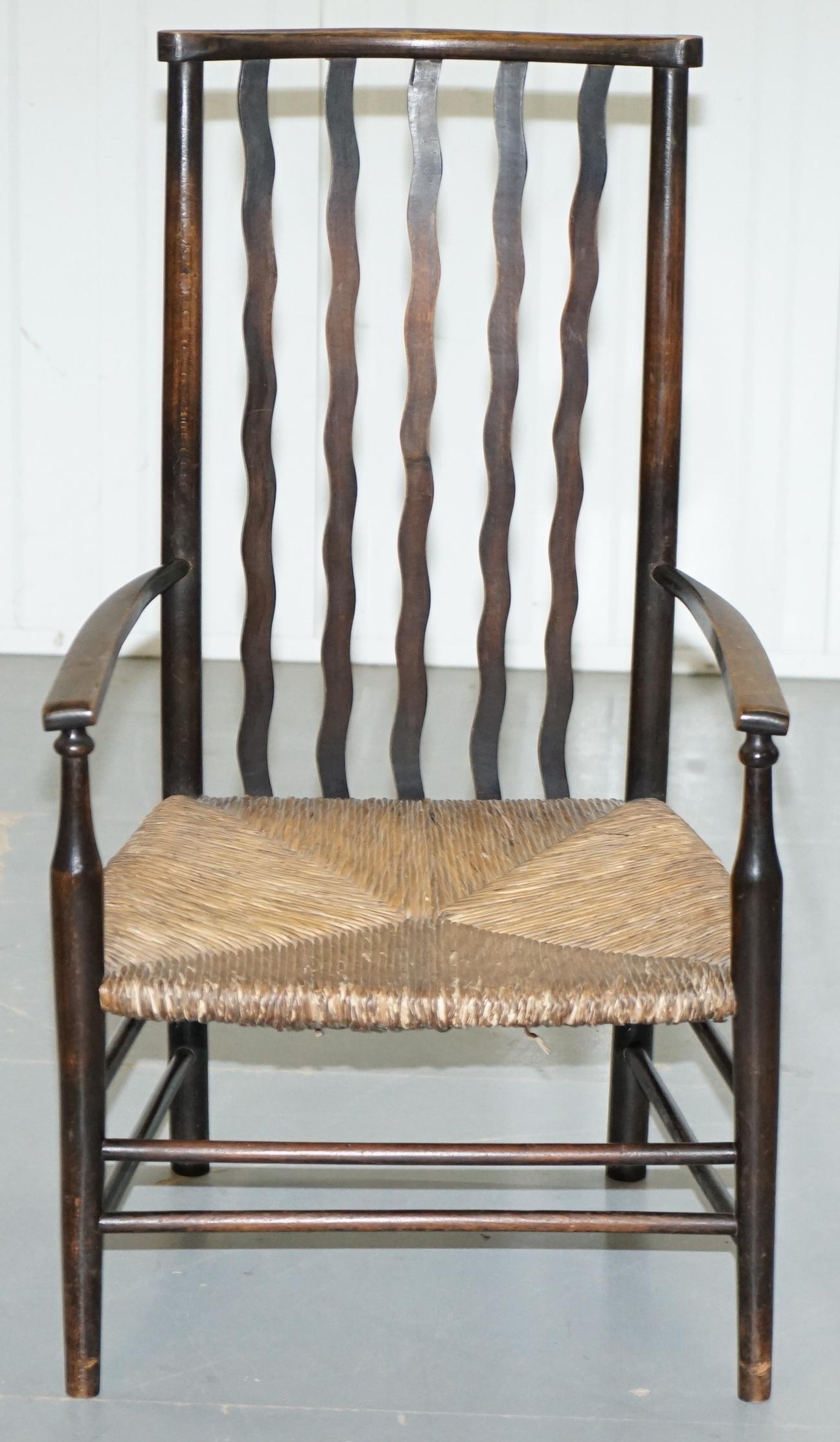 We are delighted to offer for sale this stunning Victorian Morris & Co for Liberty London ¾ size armchair with original rush seat

A good looking and highly collectable piece, the back of the chair is a real tour de force of style and design, the