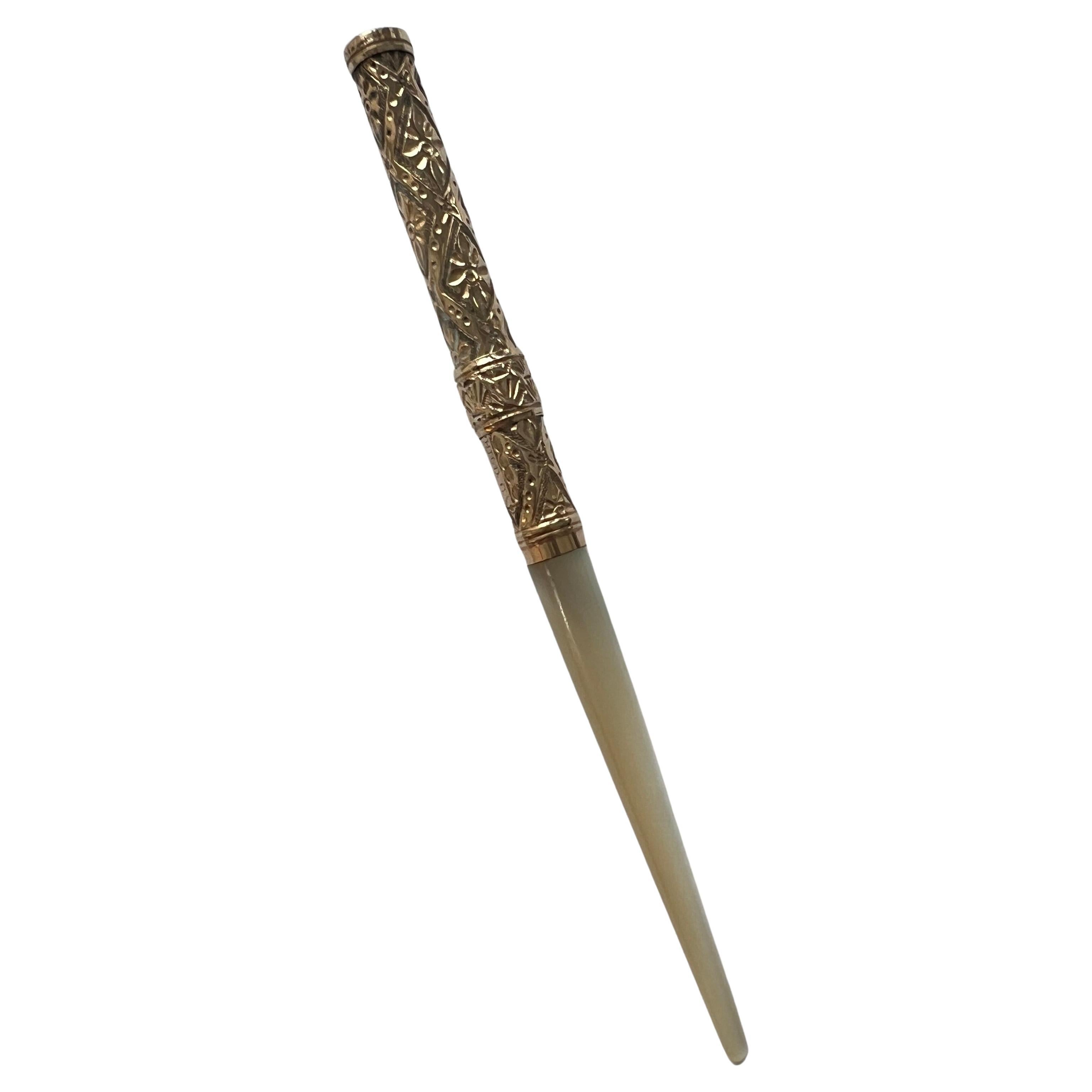 A beautiful vintage Fountain Pen - a lovely decorative piece for the desk, but also still fully functional.  The handle is Mother of Pearl that leads into an intricate Gold design and 14k tip. 

The tip is retractable - with the push of a ring up