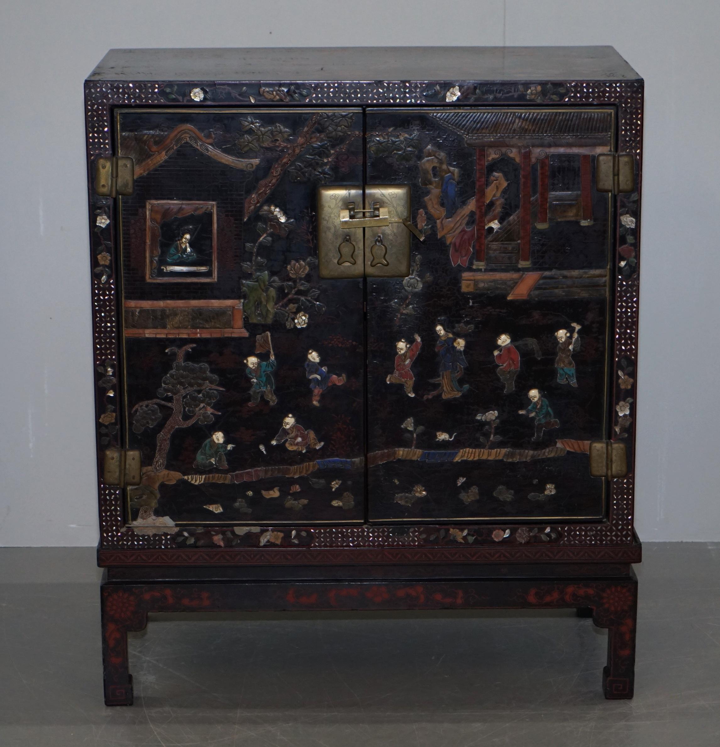 We are delighted to offer for sale this exquisite 19th century circa 1860 Chinese mother of pearl inlaid with ornately carved panels and lacquer finish cupboard

A very rare collectable and decorative cupboard on stand. This is a mid Victorian