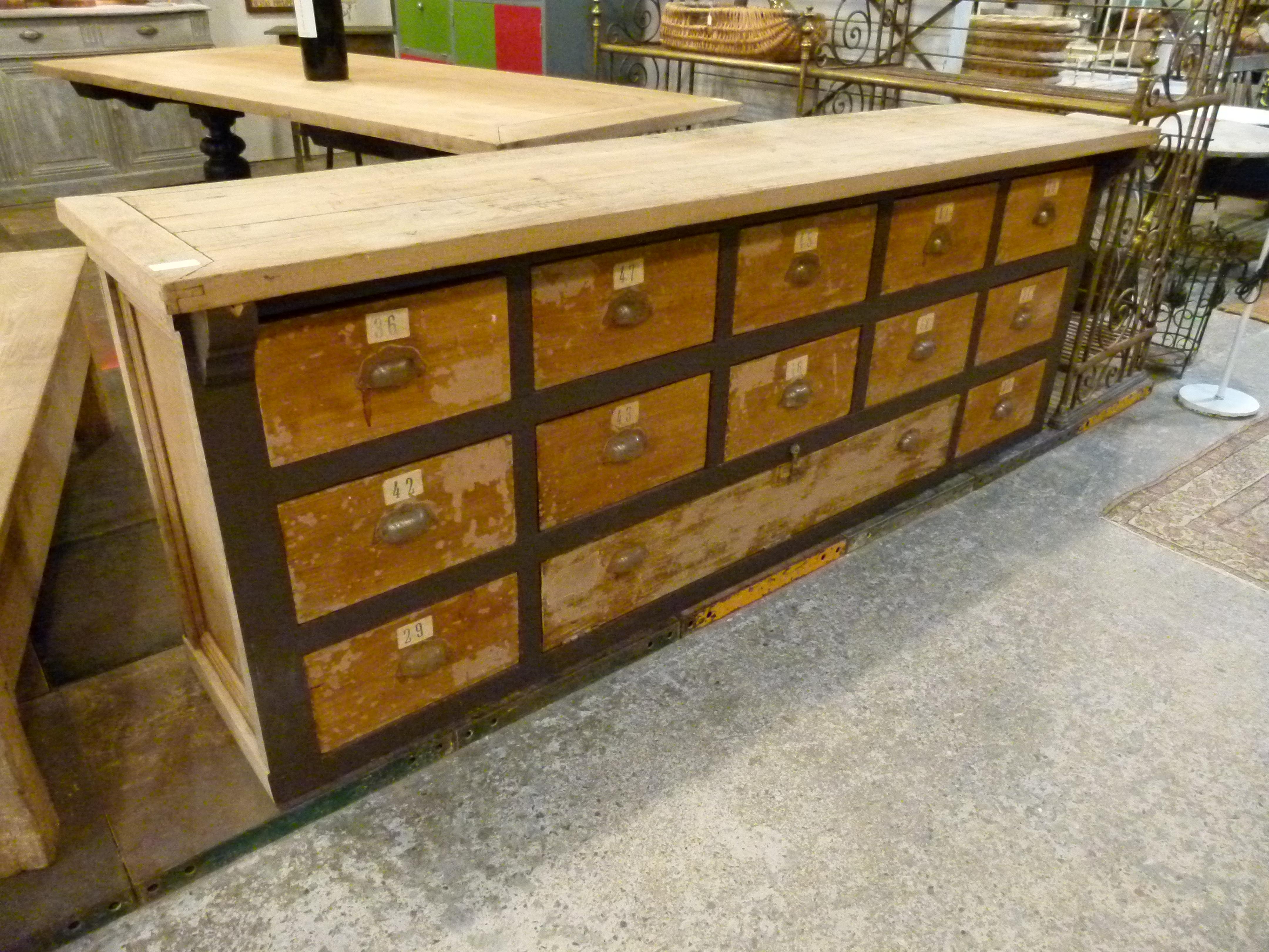 19th century multi drawer counter: 12 small drawers and a large one on the bottom.
Ideal for storing as well as decorative, bringing charm and warm to the room.

 