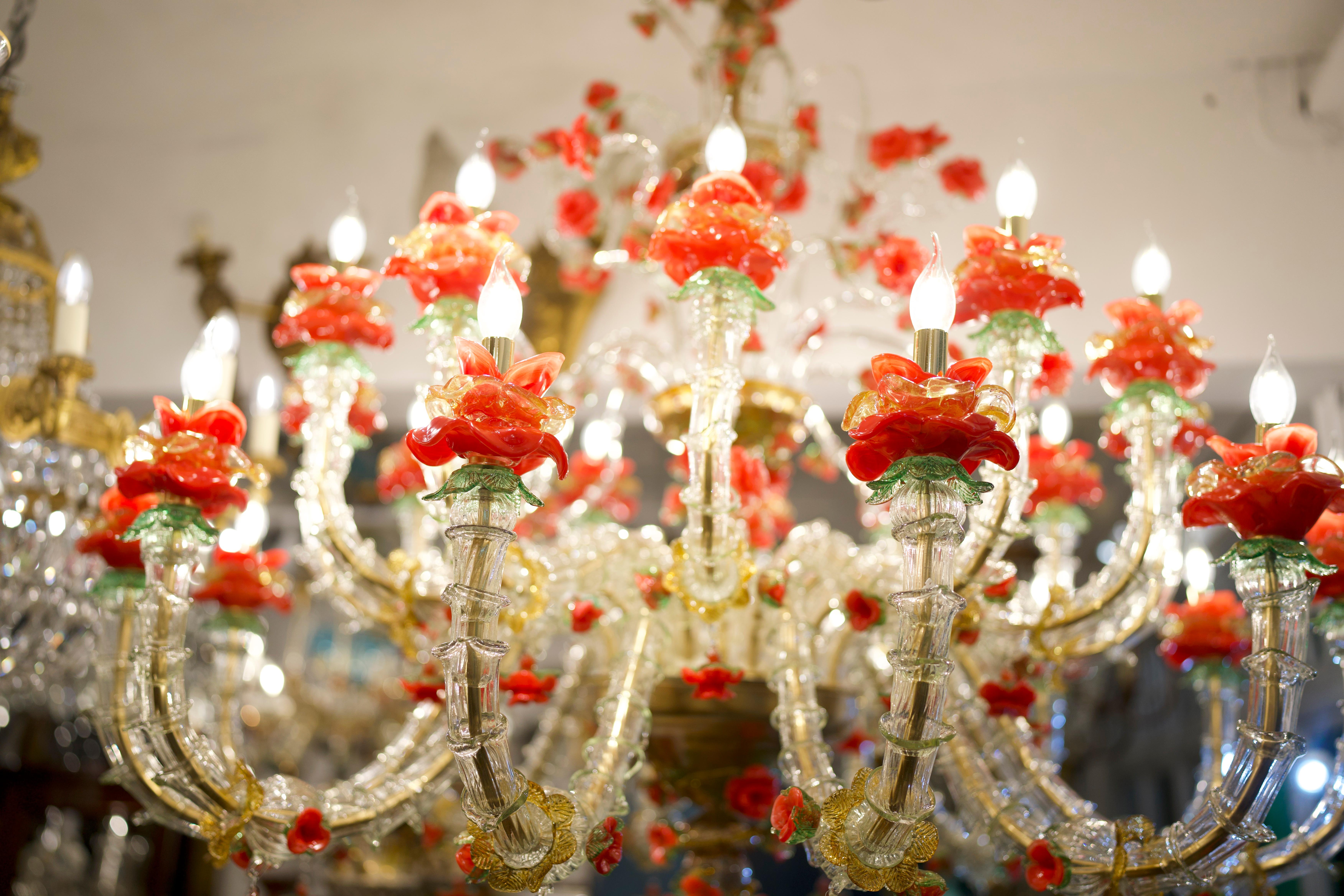  A stunning 19th Century Murano Glass Rezzonico Style Chandelier With Red Roses. 

This ornate and exuberant Venetian chandelier has been hand-crafted with the finest hand-blown glass from the famous island of Murano, and is adorned with a