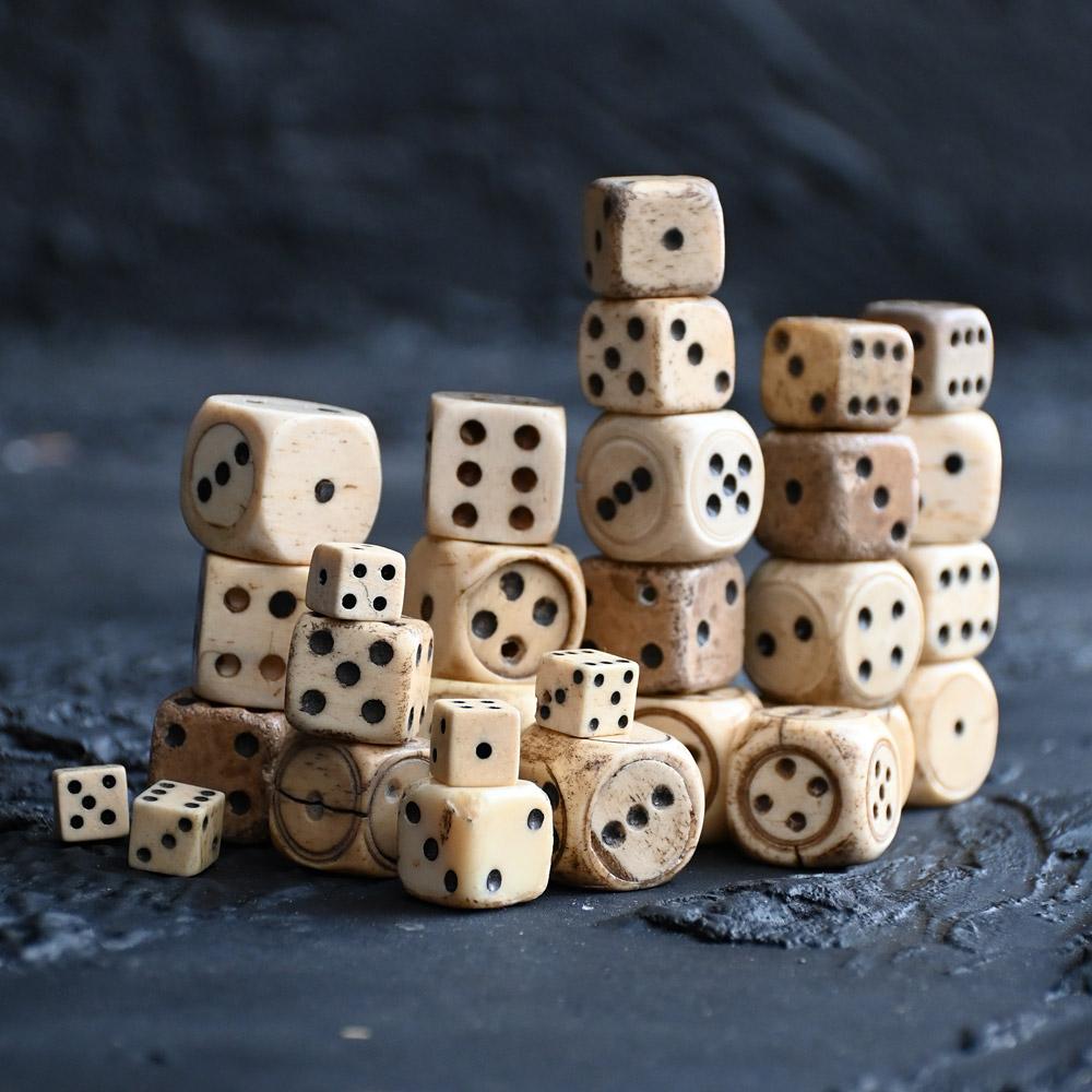19th Century Mutton Bone Hand Carved Dice Collection

A nice collection of 29 mid to late 19th Century hand carved assorted size cow or mutton bone playing dice. One with an opening section as shown, of various forms and age, some aged more than
