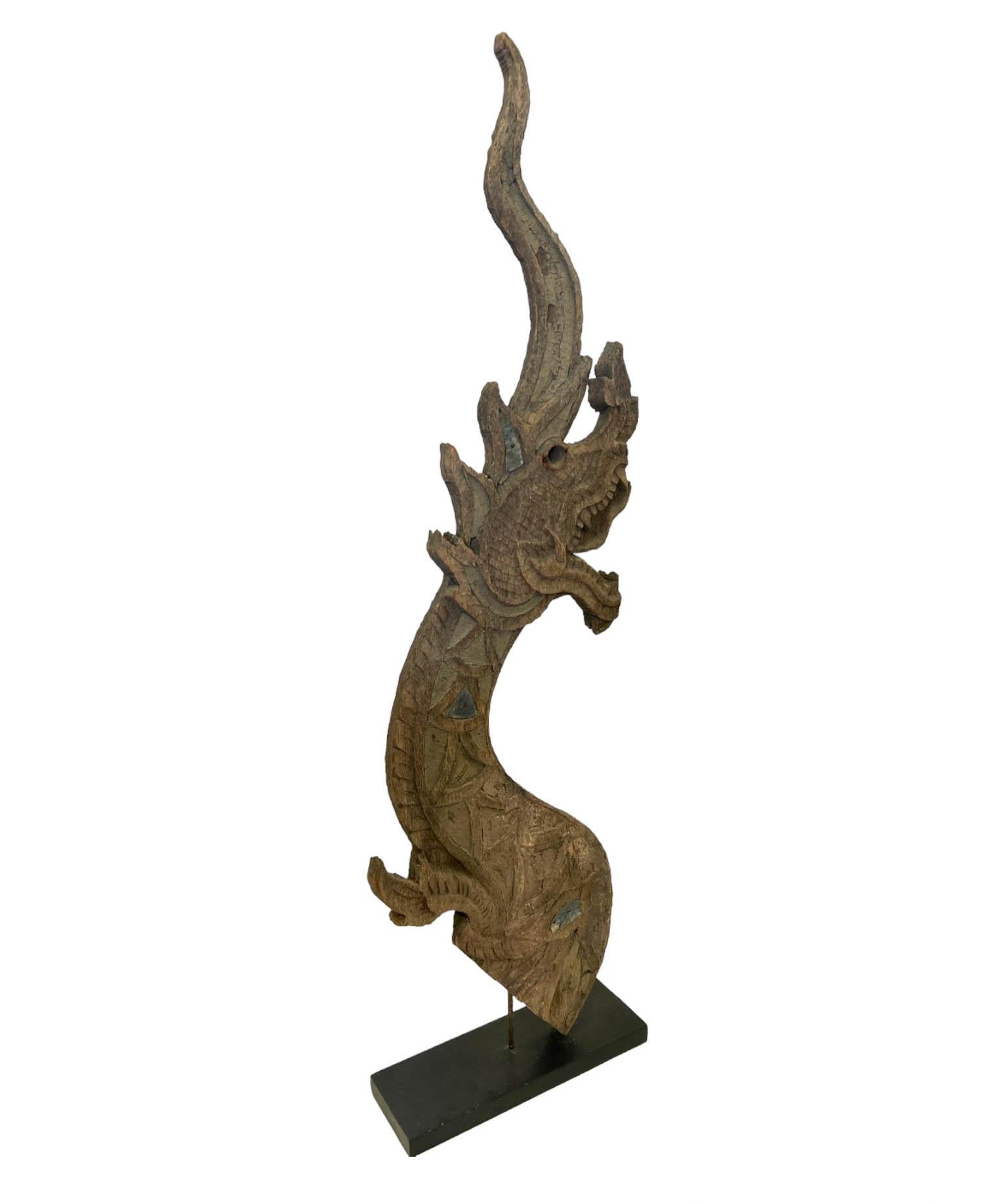 Crafted in Thailand with rich cultural significance, these temple roof finials known as naga hold profound spiritual symbolism. Traditionally used to guard against malevolent forces and natural calamities, these revered sculptures are steeped in