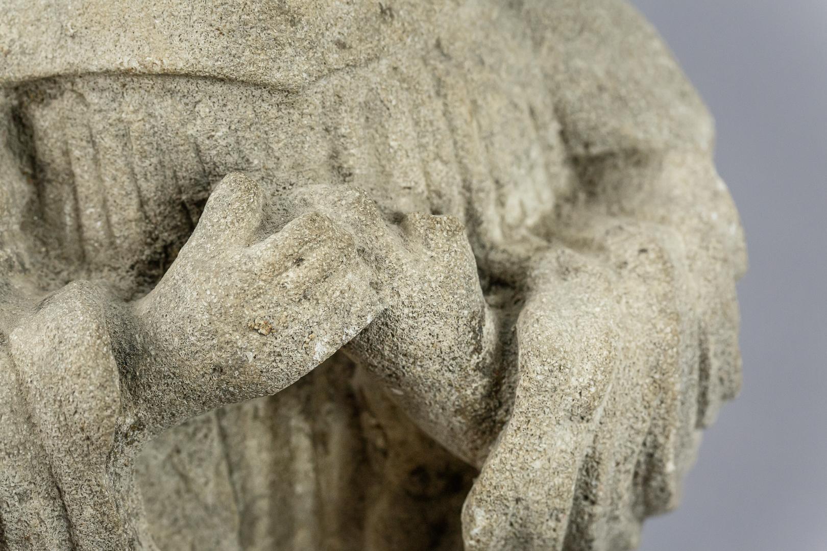 Naïve characterful carved stone Angel, wonderfully expressive and serene, France, circa 1800.
Dimensions: 19cm x 34cm x 12cm.
 