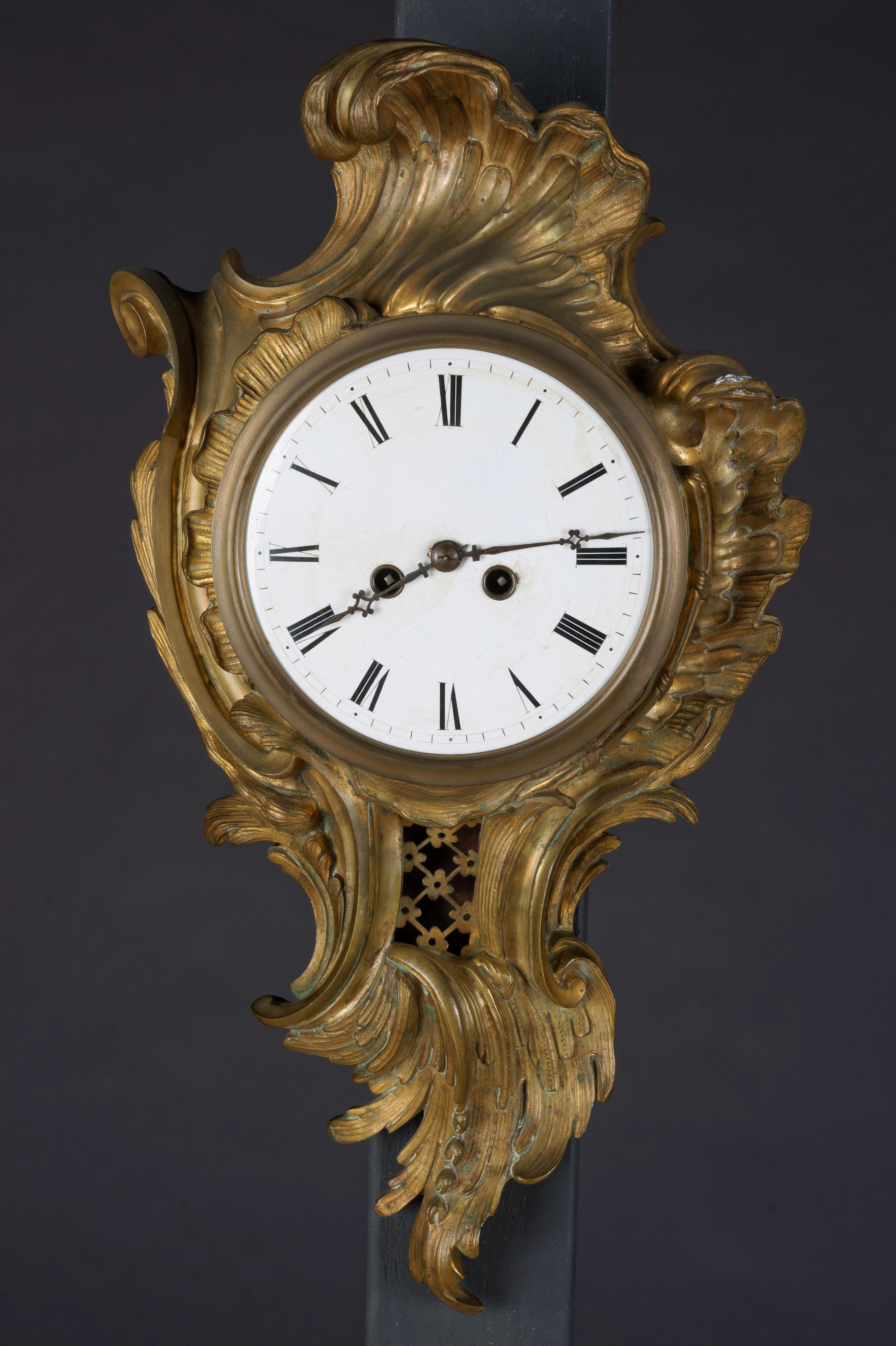 French cartel clock bronze 19th century Napoleon III.
Bronze case, matte gold-plated and polished. Pendulum window. Enamel dial with Arabic. Digits, week work with half-hour strike on bell.

(R-38).