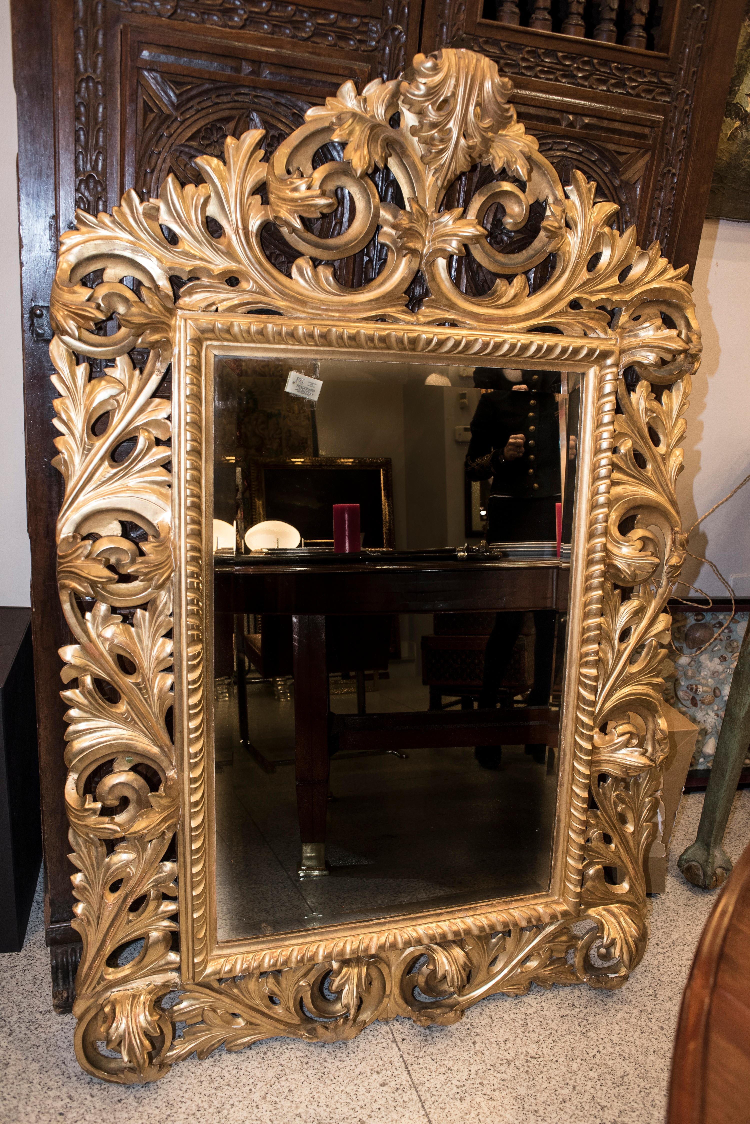Stunning Napoleon III , circa 1880 , French carved and golden wood wall mirror with Fine gold polished with agate stone..Carved leaves and roleos surrounded the rectangular profile of this amazing and unique mirror.
It has been purchased in an