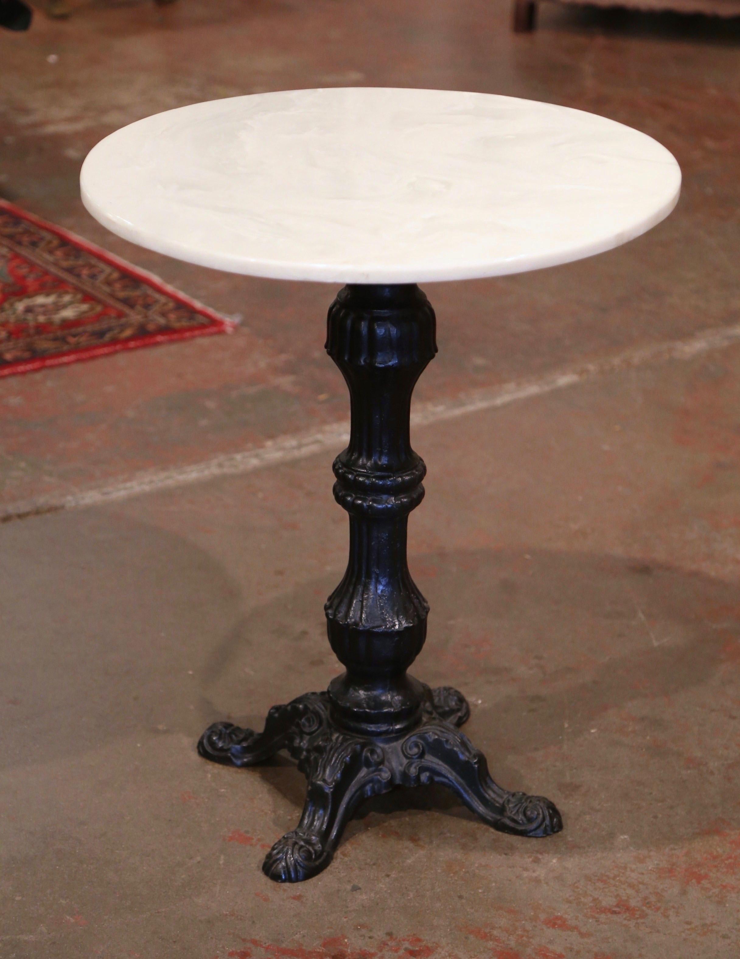 For a touch of French flair and a Parisian look, decorate a patio or a garden with this exquisite antique bistrot table; crafted in France, circa 1890, the guéridon stands on an intricate carved iron pedestal with four feet at the base. The top is