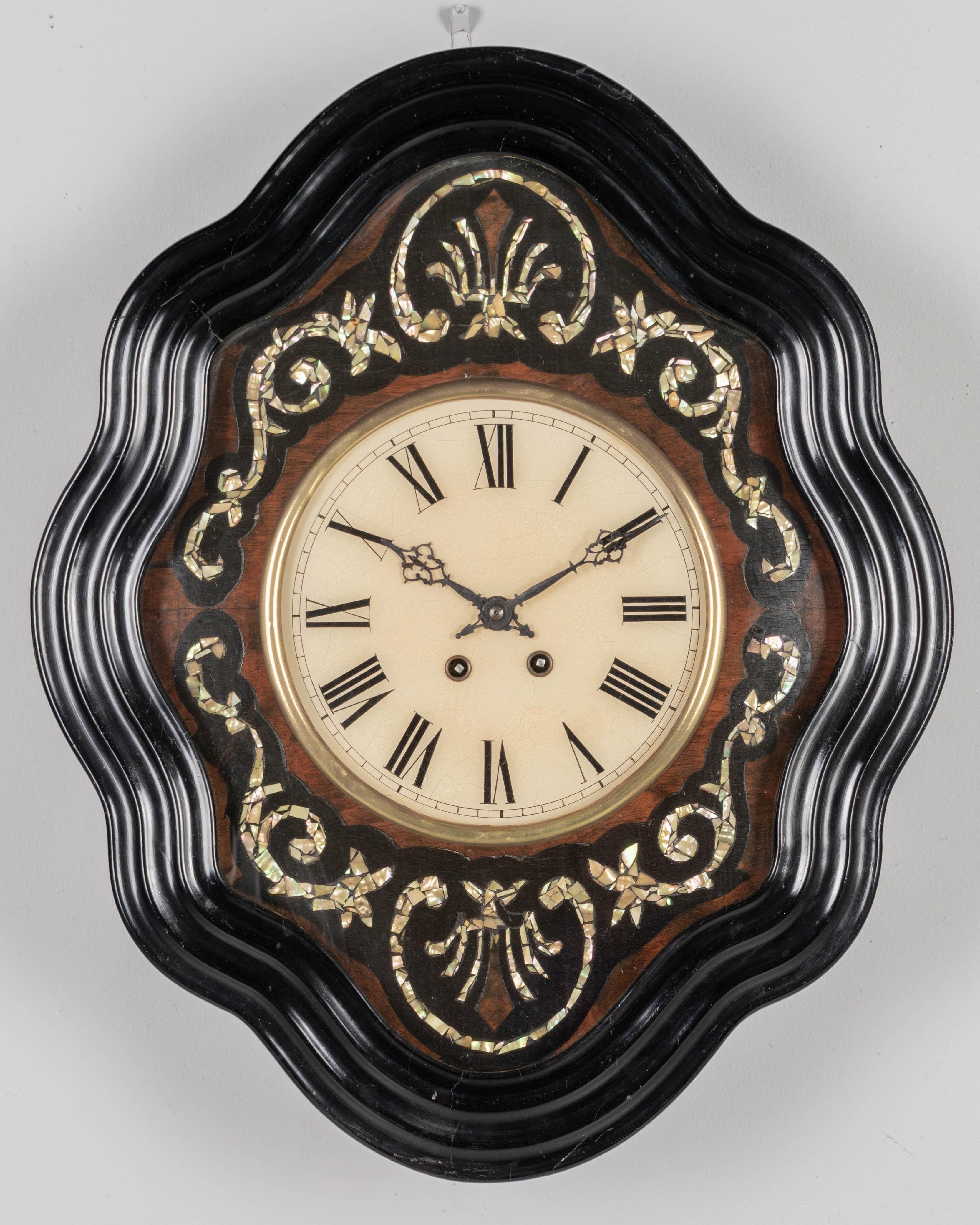 A 19th century French Napoleon III wall clock with 
