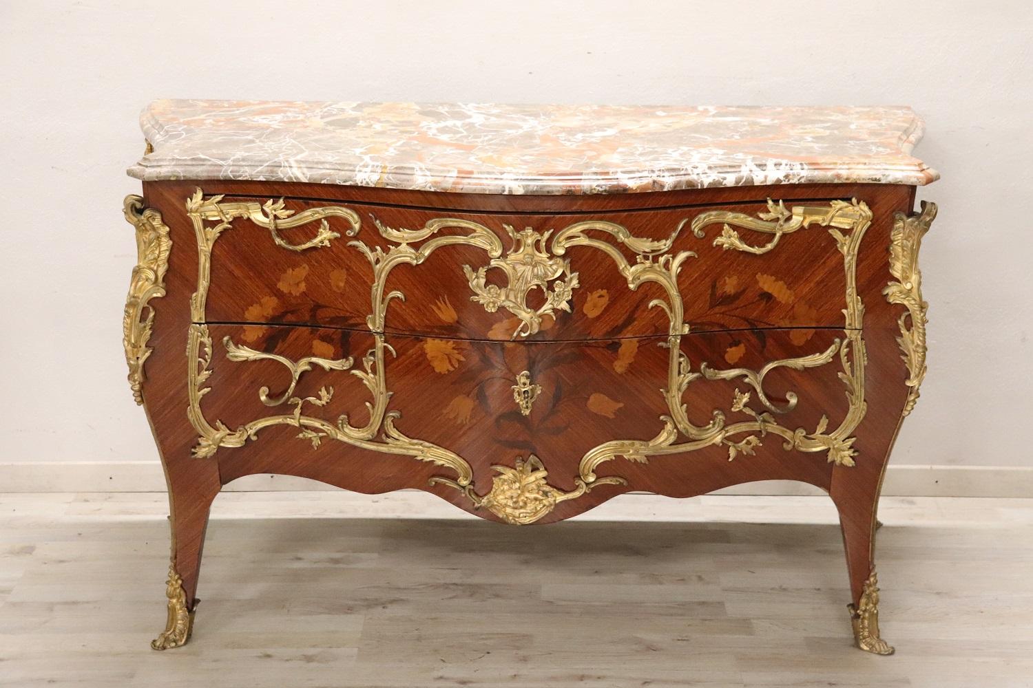 Important and rare france of the period Napoleon III antique majestic chest of drawers. Characterized by a rounded shape on the front and slender wavy legs. Refined floral-style inlaid decoration made using different woods of precious essences. The