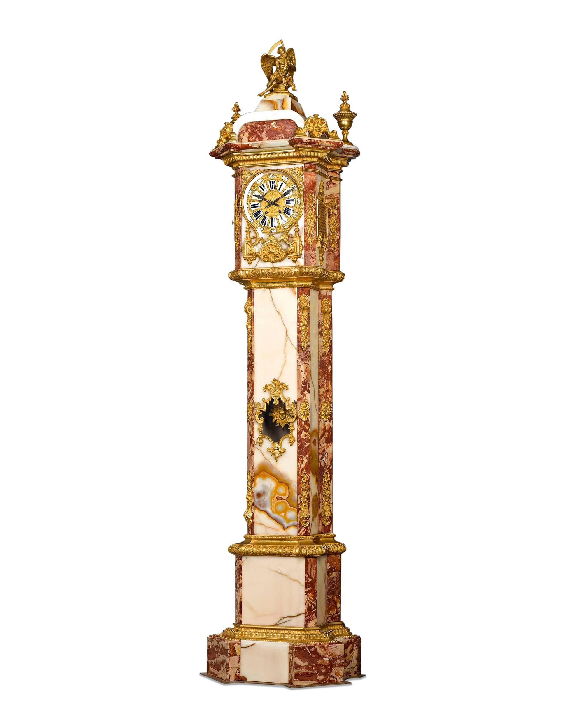 As much of a sculptural work of art as a majestic timepiece, this monumentally-sized Napoleon III longcase clock is crafted of exquisite Algerian onyx and rouge marble. Based Upon the luxurious materials and stunning size, this timepiece was almost