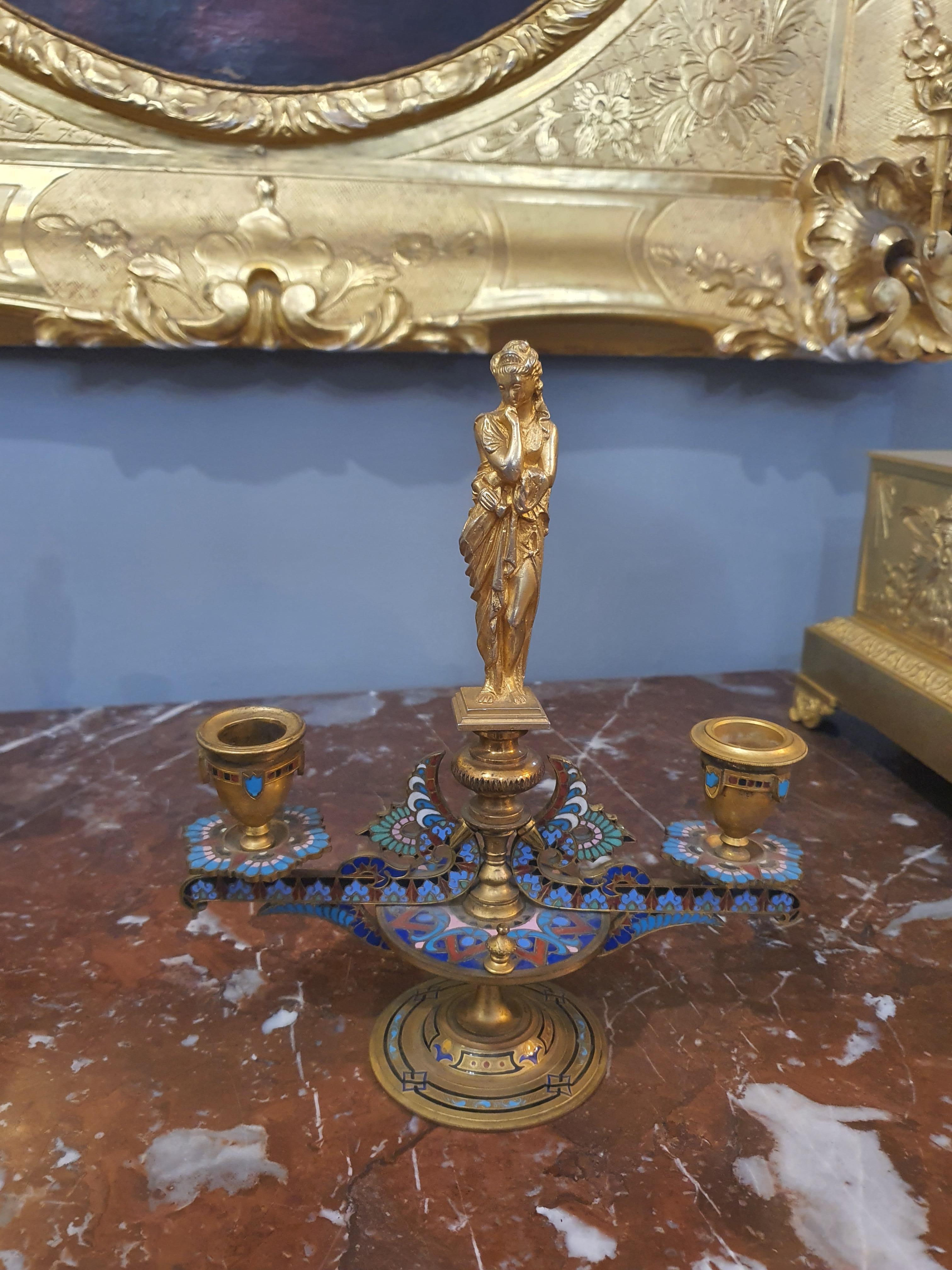 Elegant pair of finely chiseled and gilded bronze candelabra with cloisonné enamels.
Cloisonné, also called Byzantium luster, is an artistic enamel decoration technique.